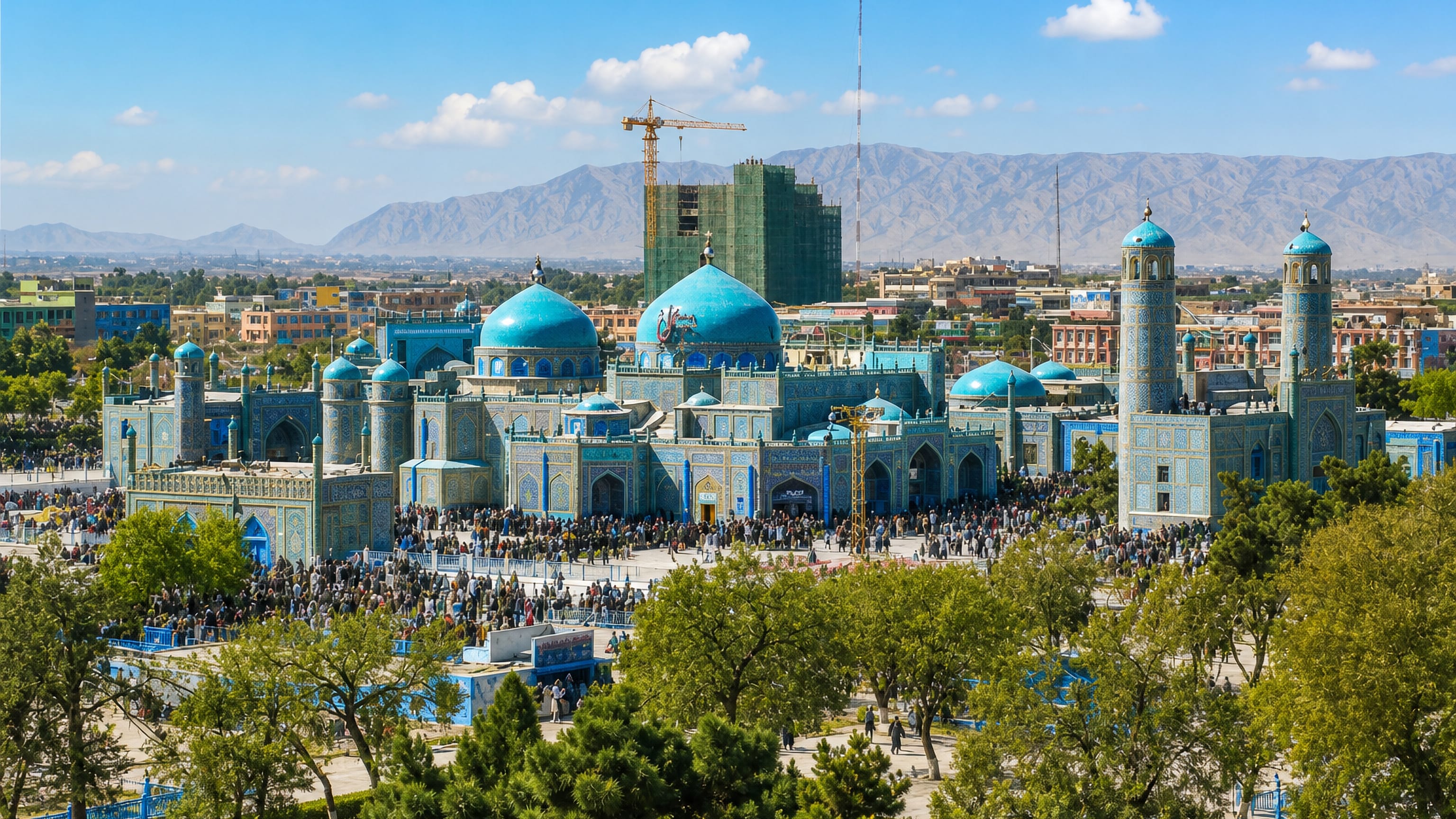 The turquoise-tiled Blue Mosque, Shrine of Ali, at the heart of Mazar-e Sharif, Afghanistan, ringed by crowds.