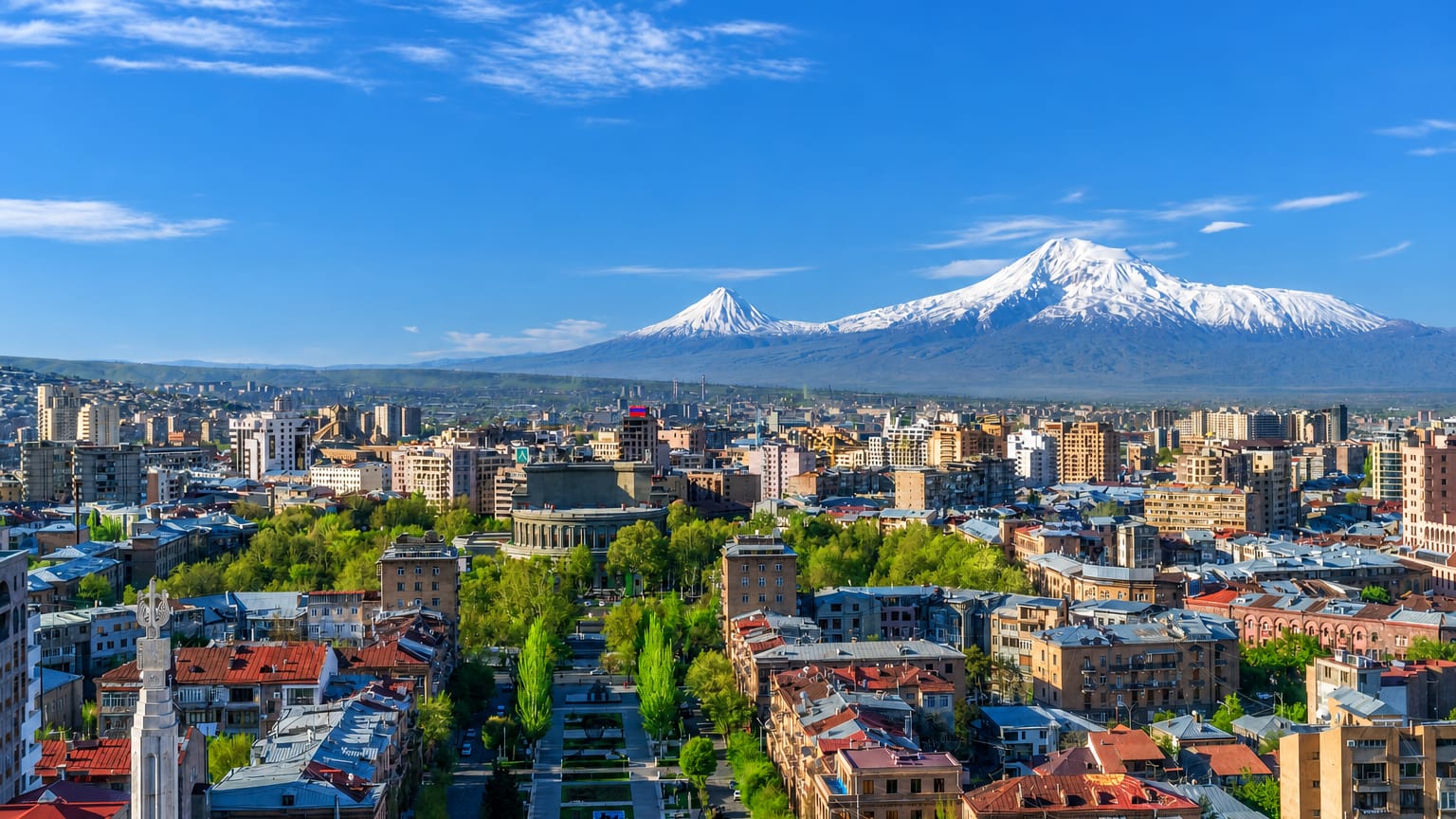 Central Yerevan's Kentron district with tree-lined avenues below the twin snow-capped peaks of Mount Ararat.