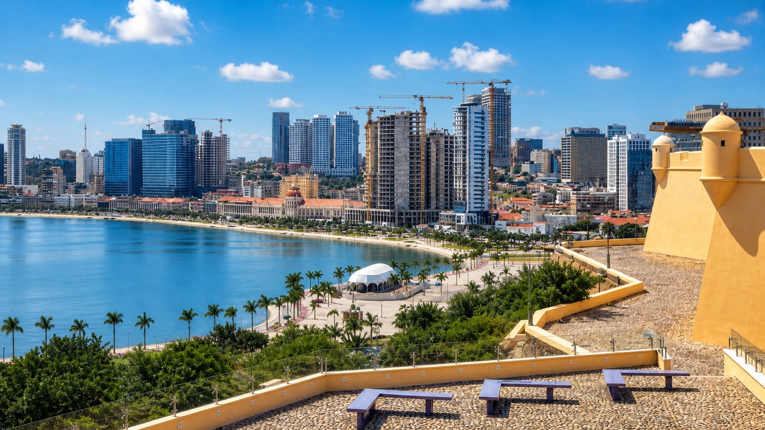 Luanda's bayfront skyline and palm-lined Marginal seen from the yellow Fortress of Sao Miguel