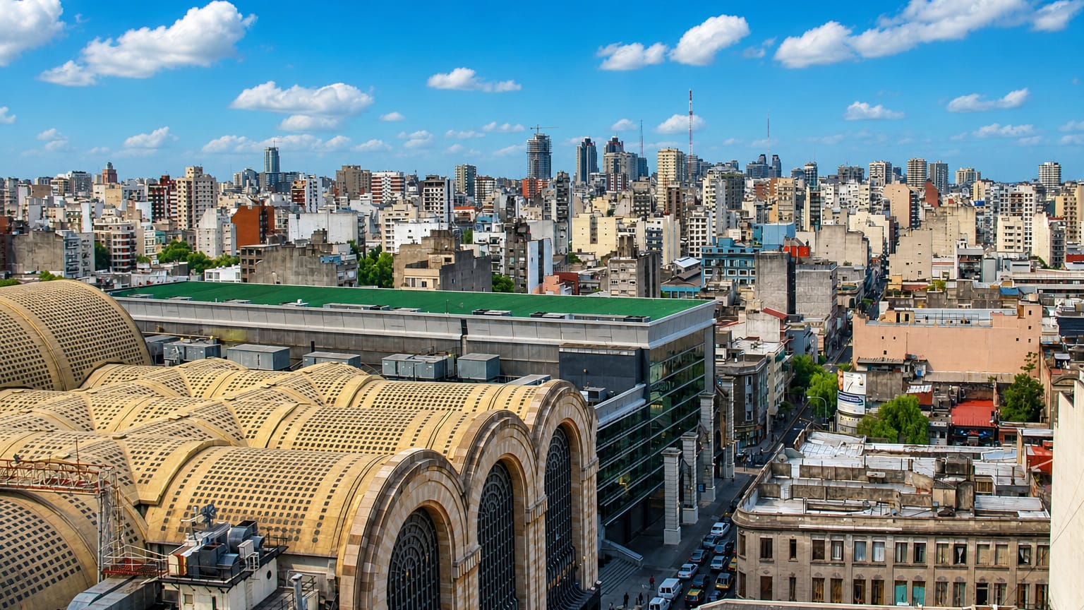 Art Deco vaulted roofs of the historic Abasto market building above the dense Abasto neighborhood of Buenos Aires