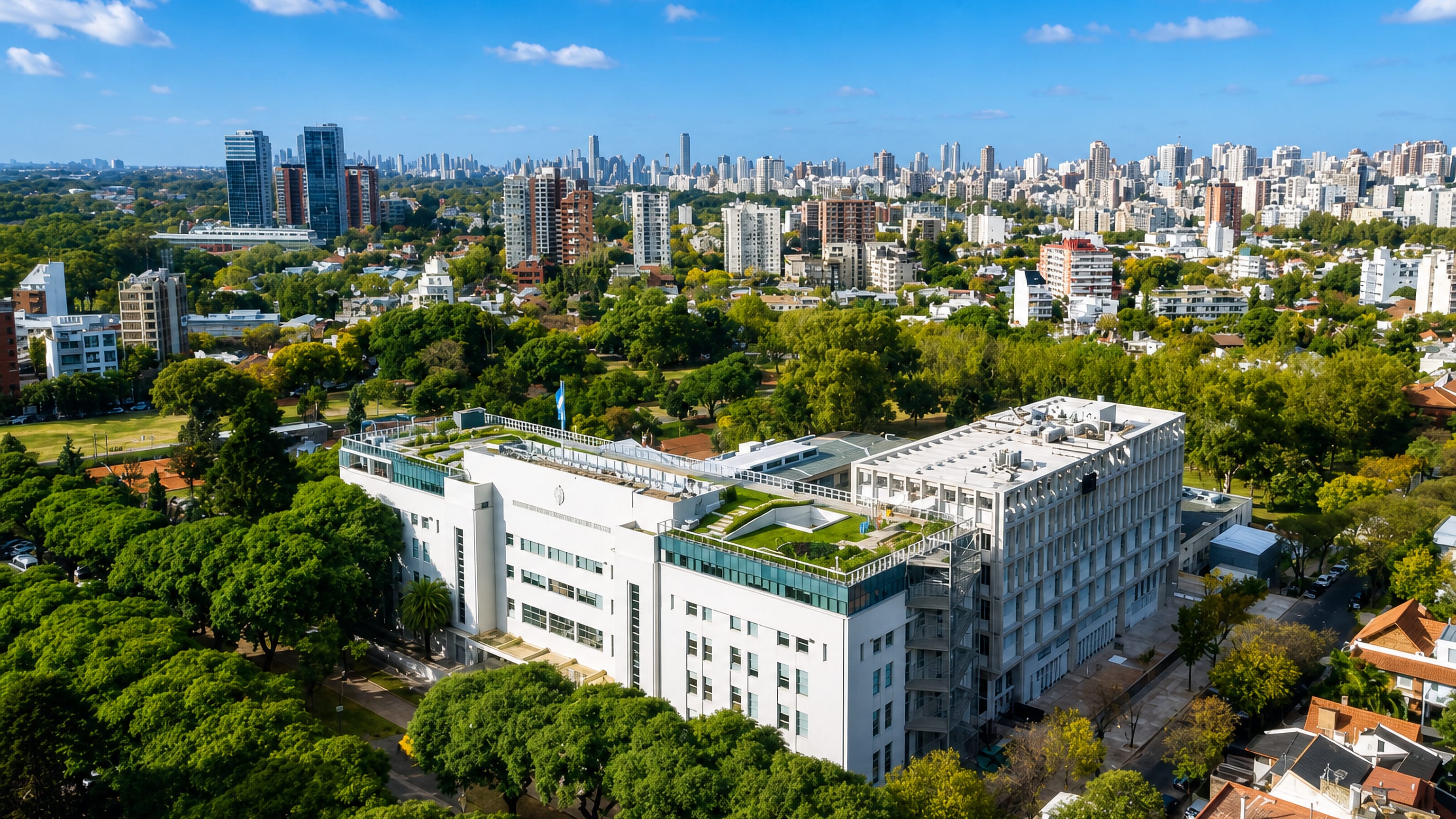 Leafy streets and apartment towers of Belgrano, Buenos Aires, with the city's skyline on the horizon.