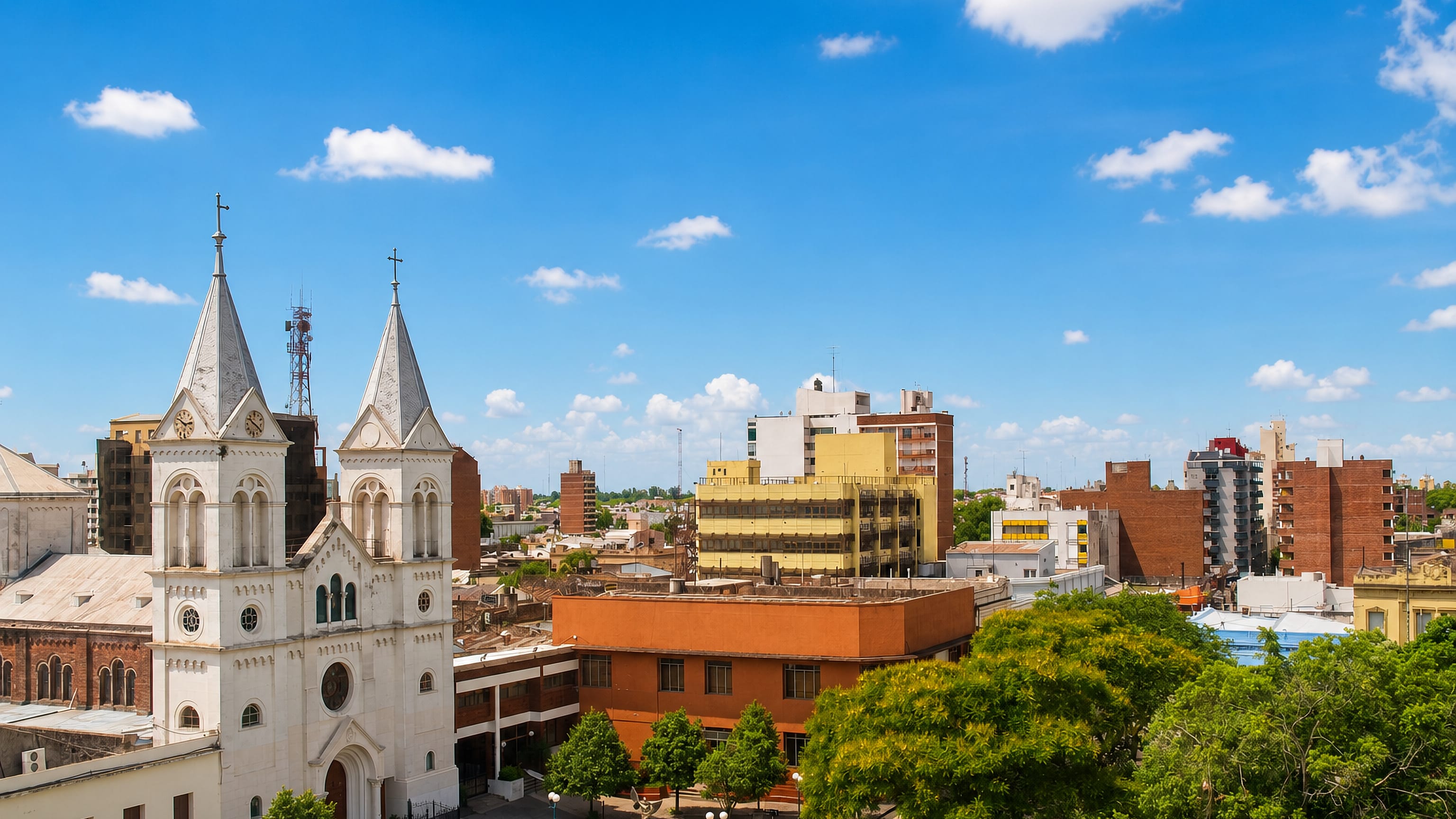 Twin-spired cathedral rising over the plaza and low rooftops of Concordia, Entre Rios, Argentina.