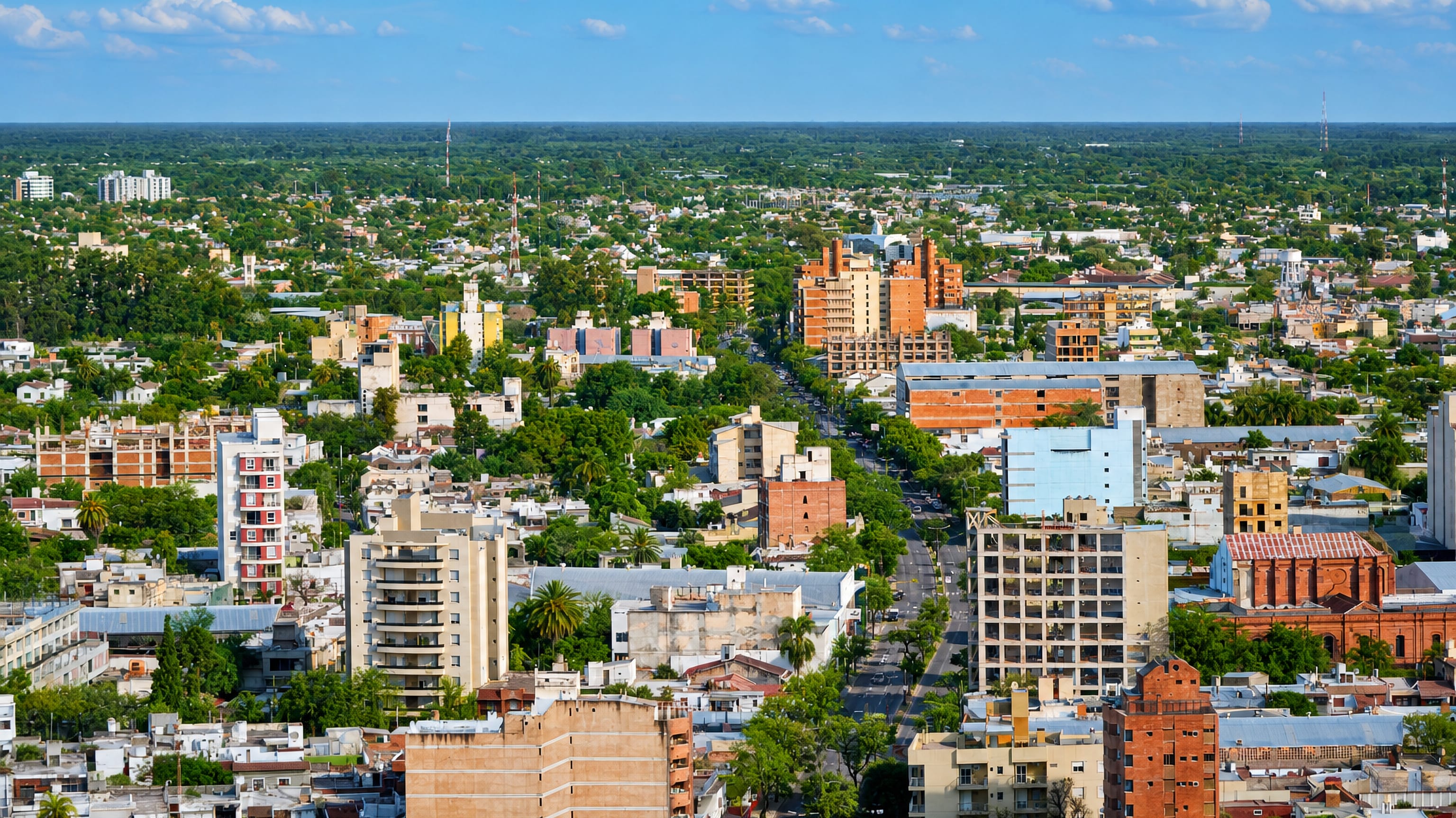 Santiago del Estero, Argentina, low-rise blocks and a wide avenue stretching to the flat Chaco horizon.