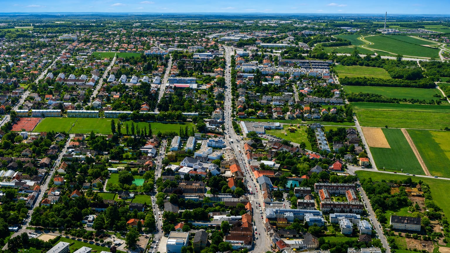 Aerial of the low-rise suburb of Essling on Vienna's eastern edge, with houses giving way to open farmland