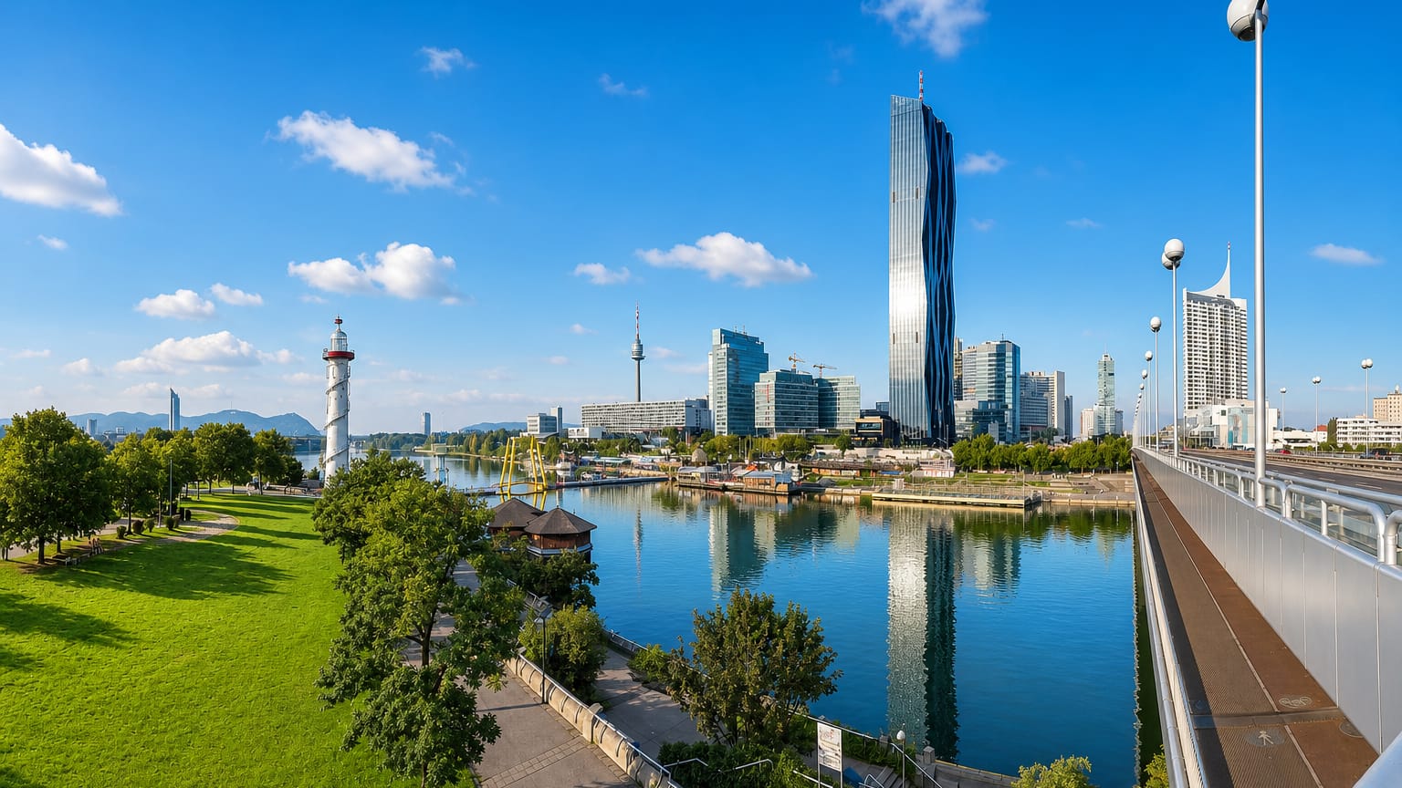 Vienna's Donau City skyline with the twisted DC Tower and Danube Tower reflected in the New Danube on a sunny day.