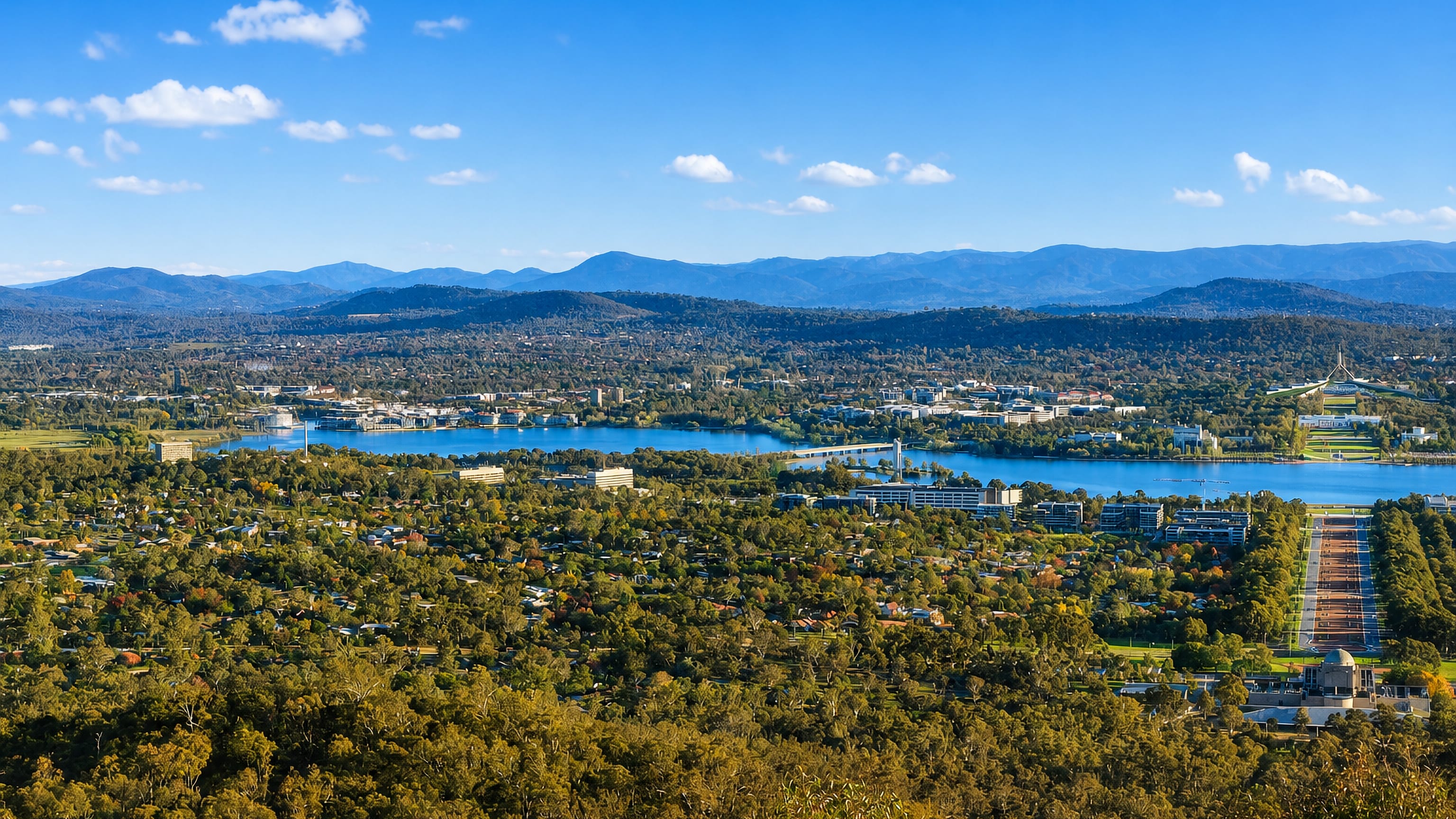Panorama from Mount Ainslie over Campbell, Anzac Parade and Lake Burley Griffin toward Canberra's hills