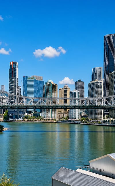 Brisbane's Story Bridge spanning the river with the CBD skyline behind, near Fortitude Valley.