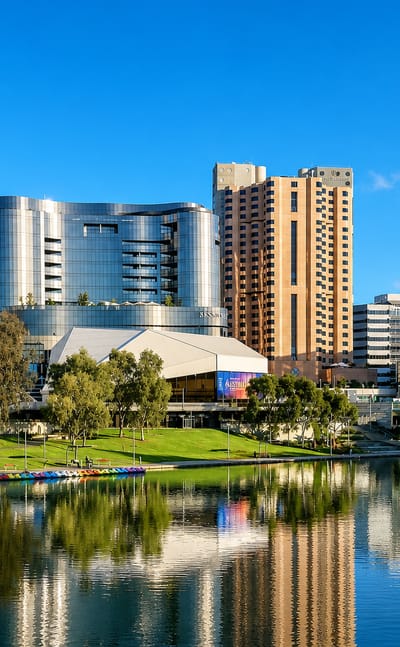 Adelaide's Riverbank precinct along the Torrens with the Festival Centre and towers reflected in the water