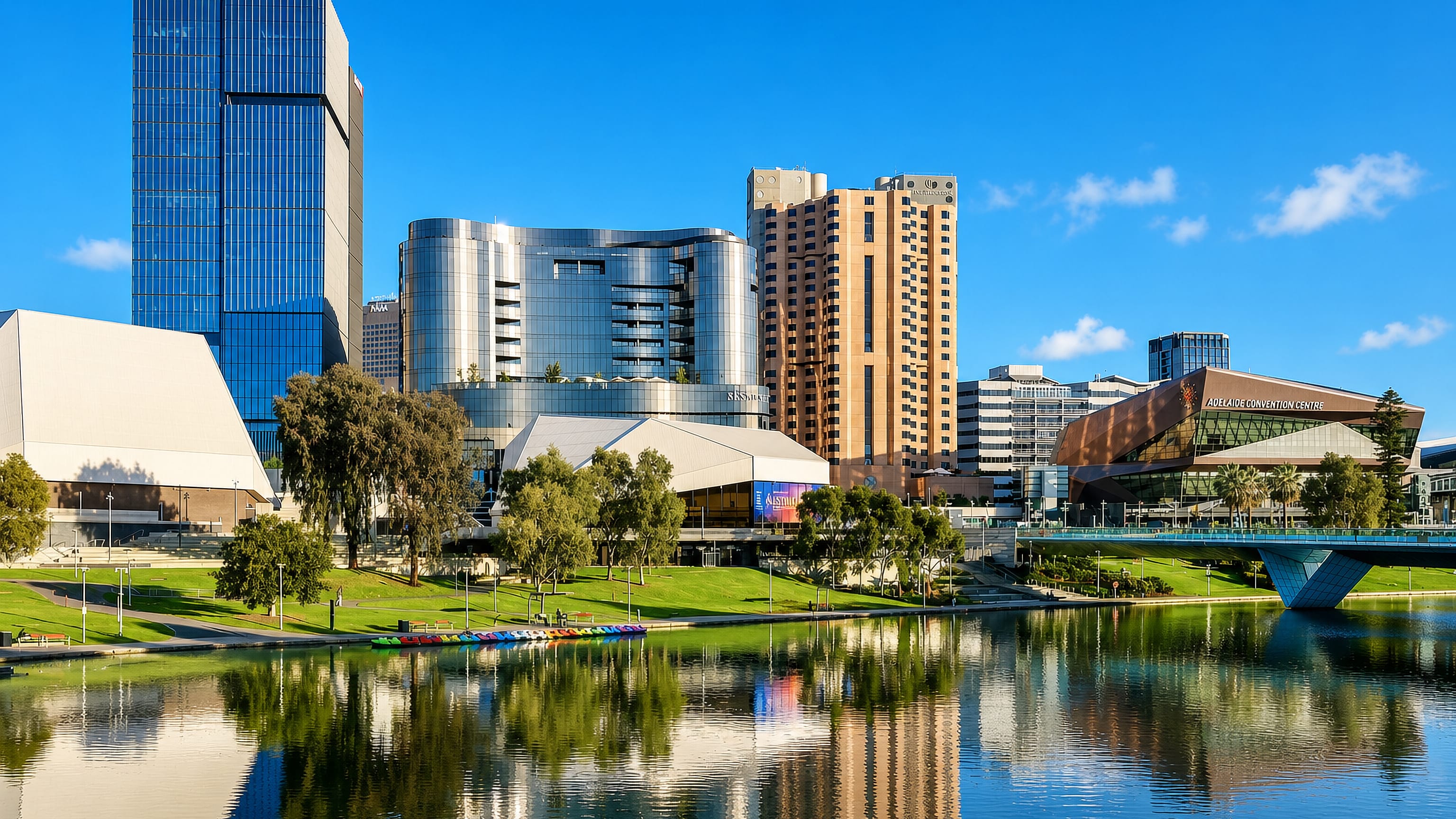 Adelaide's Riverbank precinct along the Torrens with the Festival Centre and towers reflected in the water