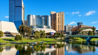 Adelaide's Riverbank precinct along the Torrens with the Festival Centre and towers reflected in the water