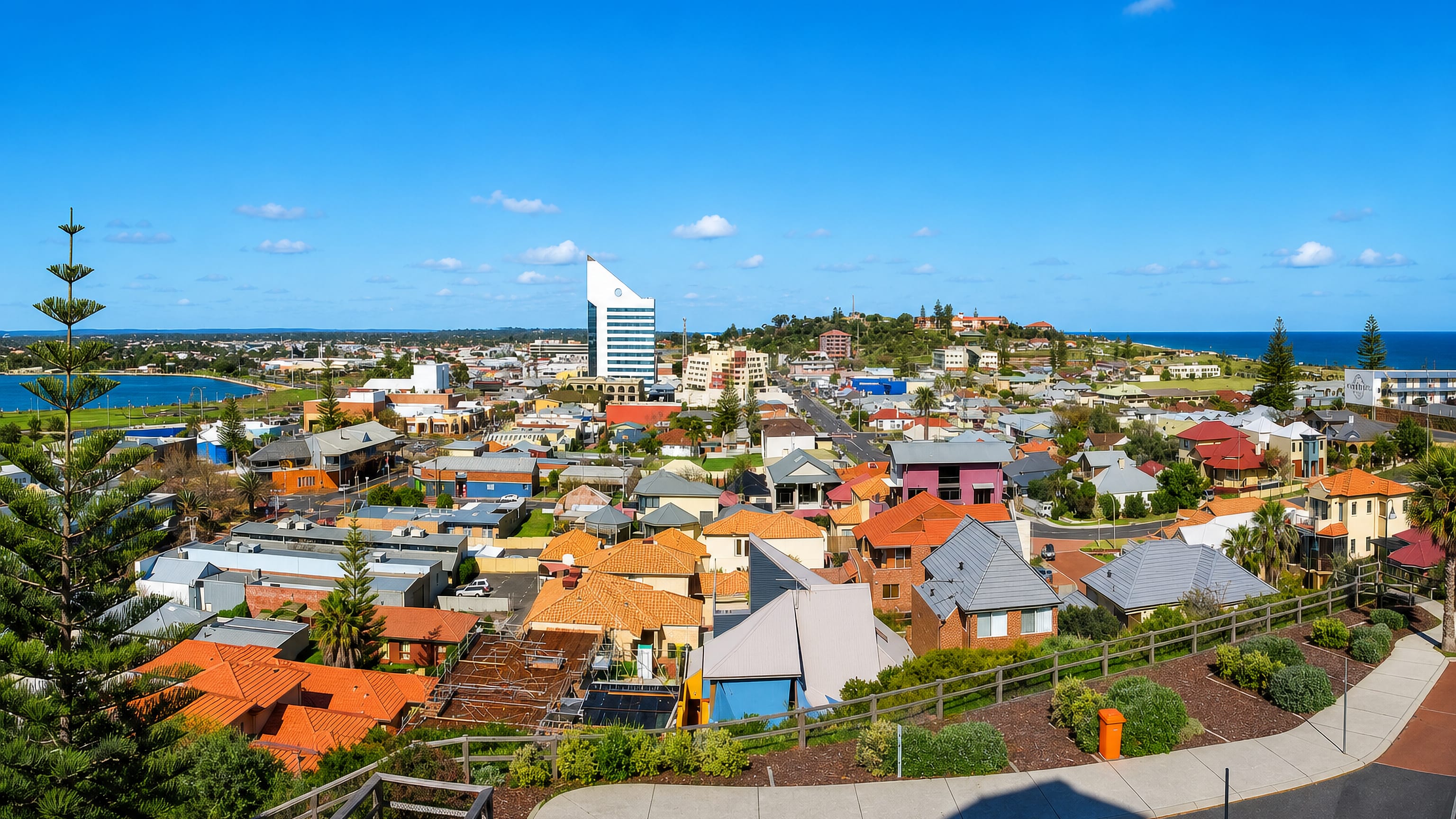 Elevated view of Bunbury, Western Australia, with the blue-glass Bunbury Tower between the inlet and the ocean.