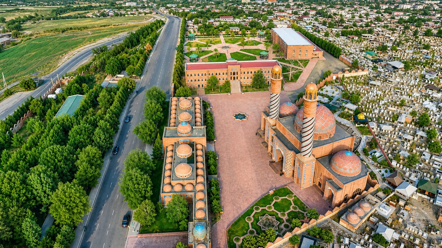 Ganja, Azerbaijan, aerial of the Imamzadeh mausoleum complex with striped minarets, brick domes and gardens.