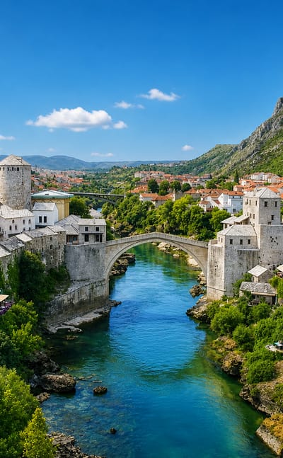 Mostar's arched Stari Most bridge spanning the turquoise Neretva River amid the old town's stone houses.