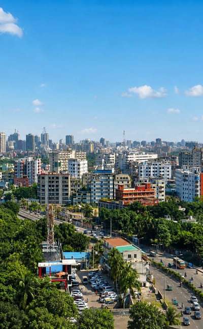 Leafy aerial view of the Mohakhali DOHS residential area of Dhaka with mid-rise buildings and a wide avenue