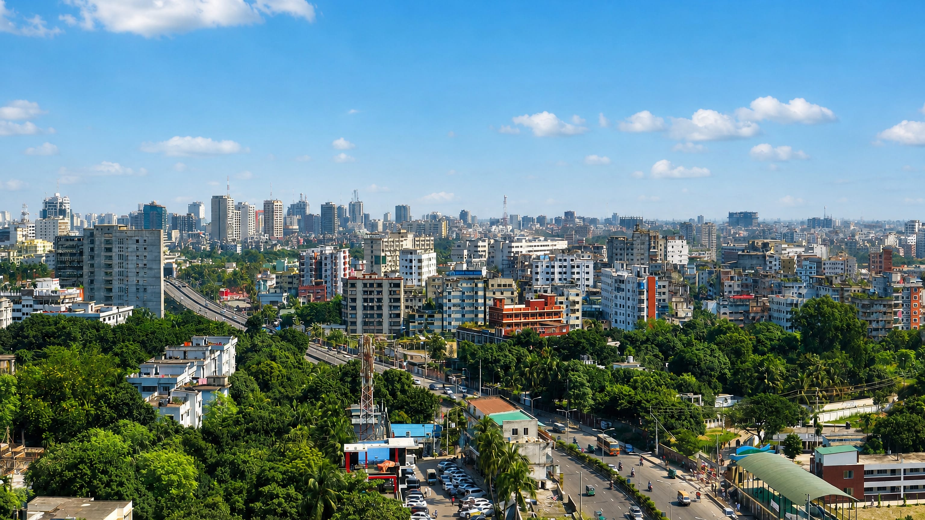 Leafy aerial view of the Mohakhali DOHS residential area of Dhaka with mid-rise buildings and a wide avenue