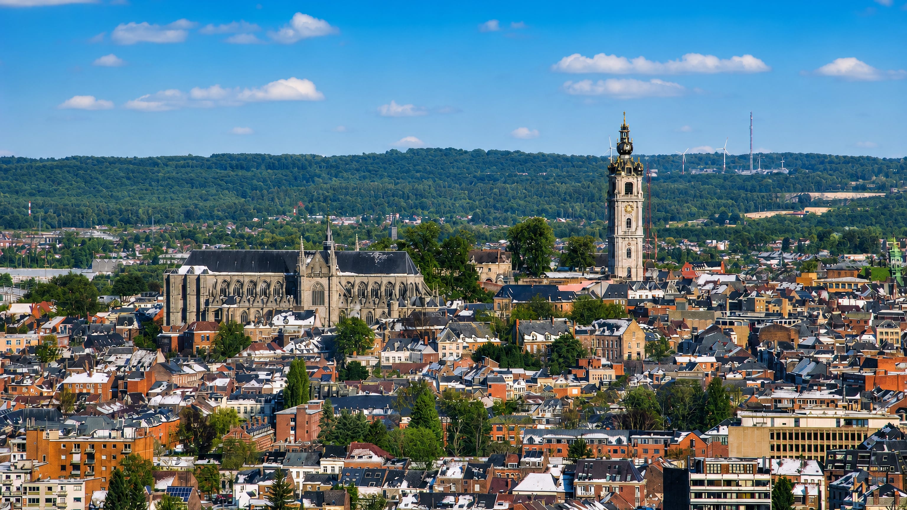 Elevated view over Mons, Belgium, with its baroque belfry and the Gothic Collegiate Church of Saint Waltrude