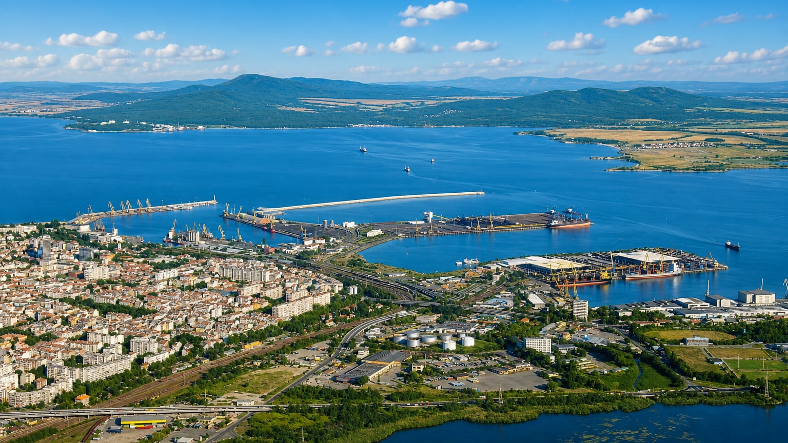 Aerial view of Burgas on the Black Sea, its harbour cranes and breakwaters ringed by the city and coastal hills