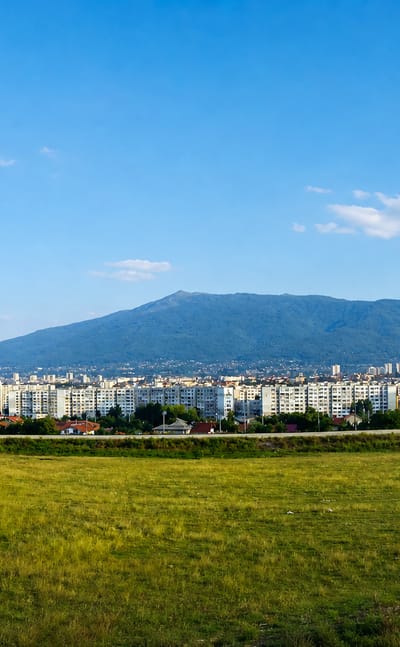 Low-rise residential Ovcha kupel district spread beneath Vitosha mountain in Sofia