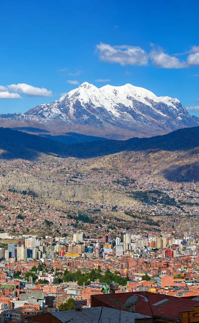 La Paz spread across its Andean valley with the snow-capped Illimani peak behind