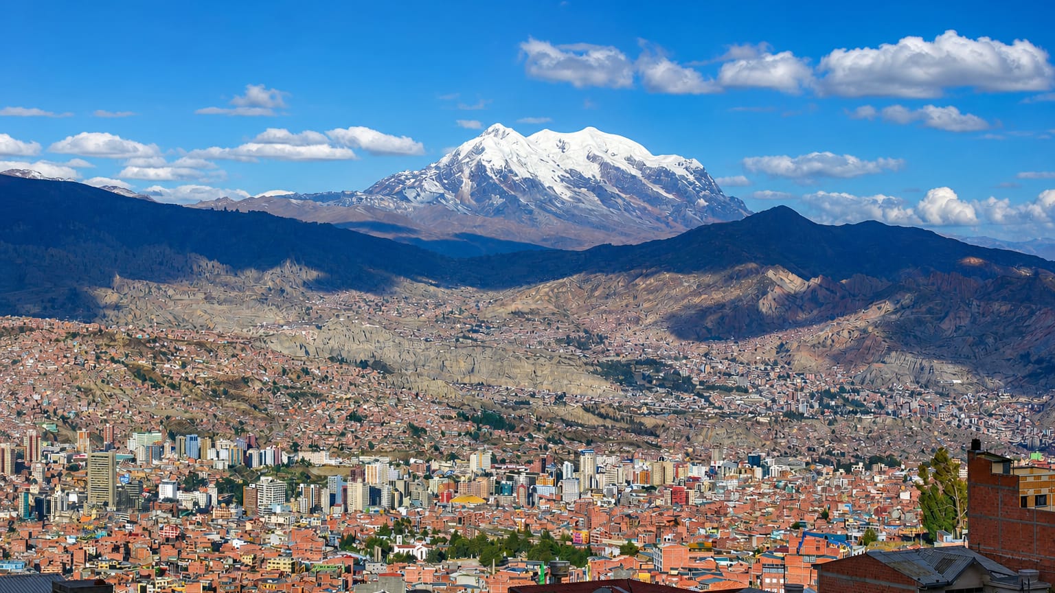 La Paz spread across its Andean valley with the snow-capped Illimani peak behind