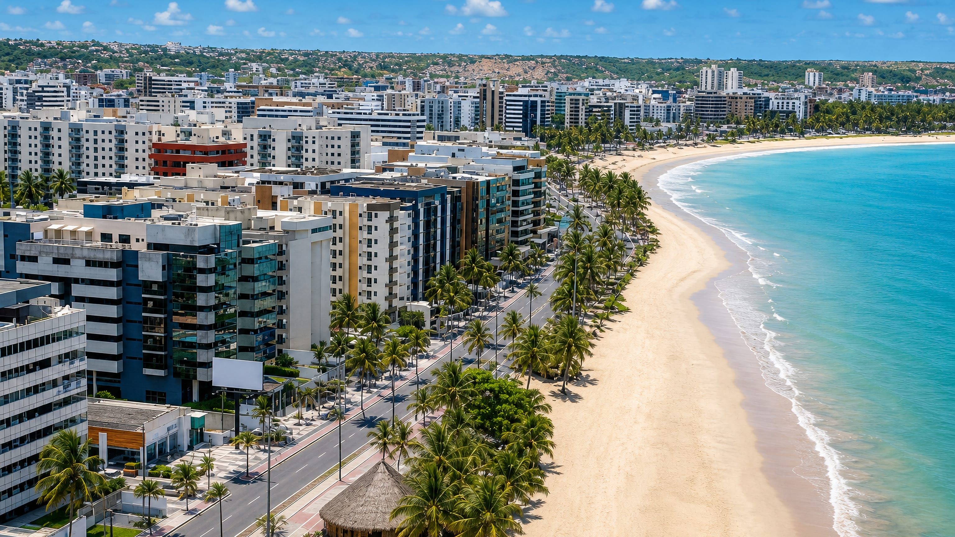 Maceio's palm-lined beachfront avenue and high-rises curving along turquoise Atlantic water in Alagoas, Brazil.