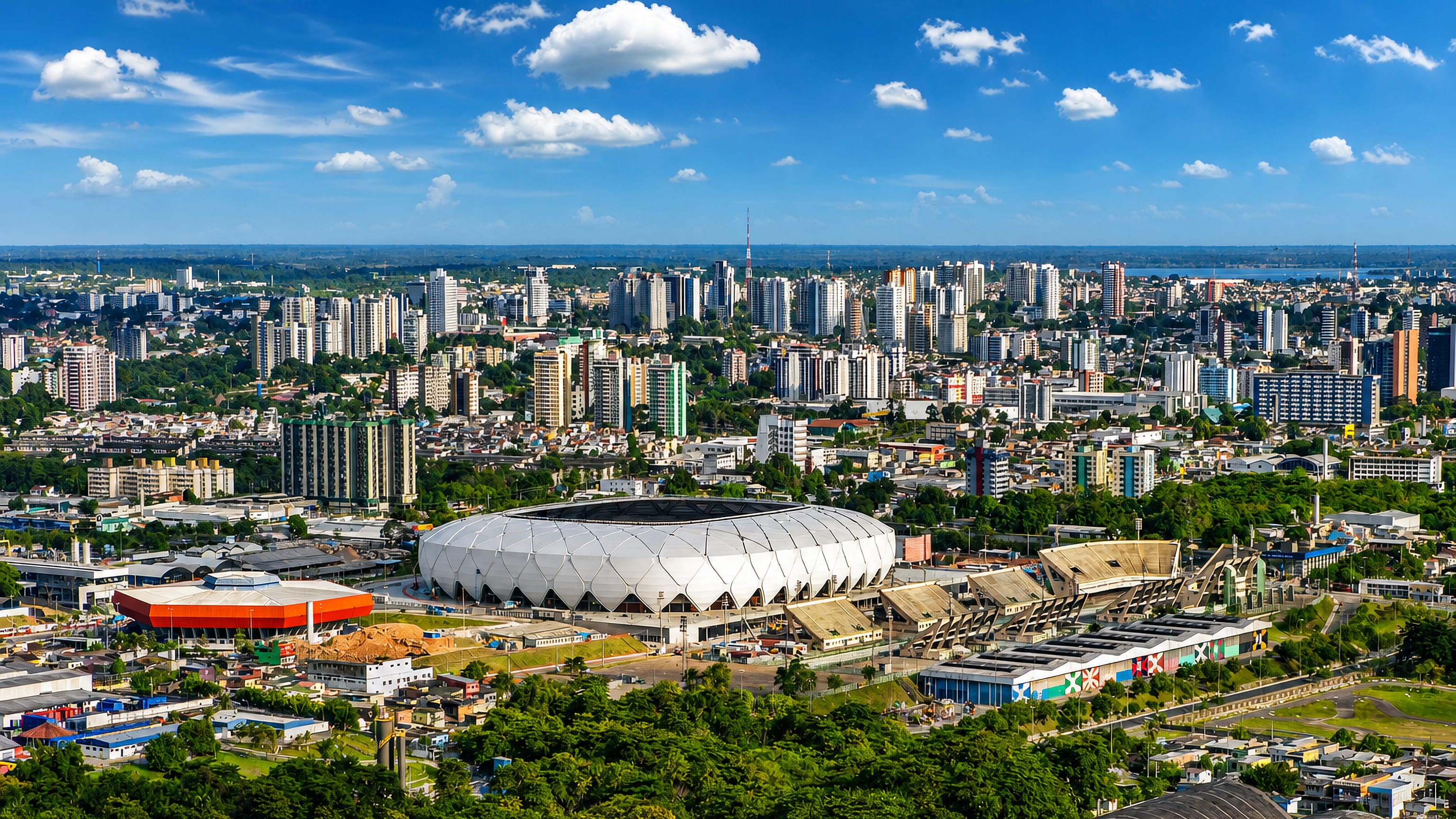 Manaus skyline with the white lattice Arena da Amazonia stadium ringed by Amazon rainforest.