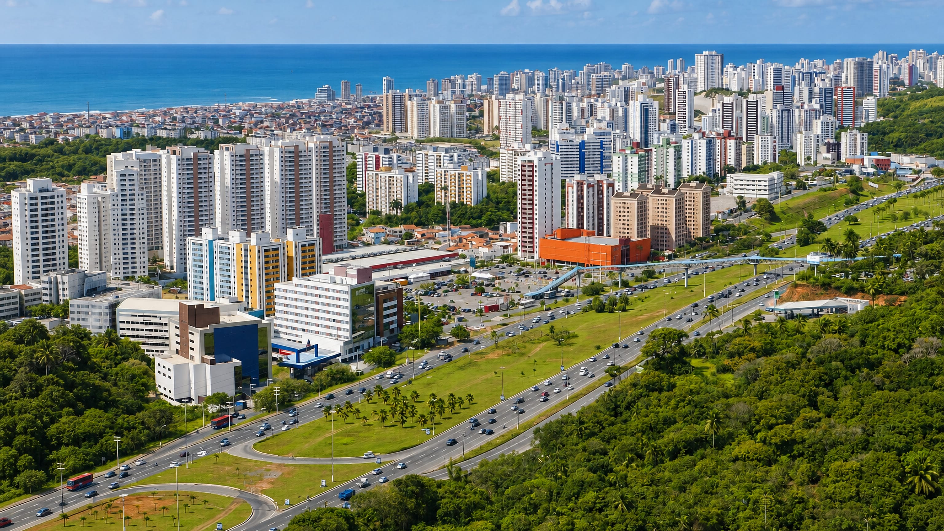 High-rise condominiums lining a palm-fringed avenue between Atlantic forest and the sea in Imbuí, Salvador.