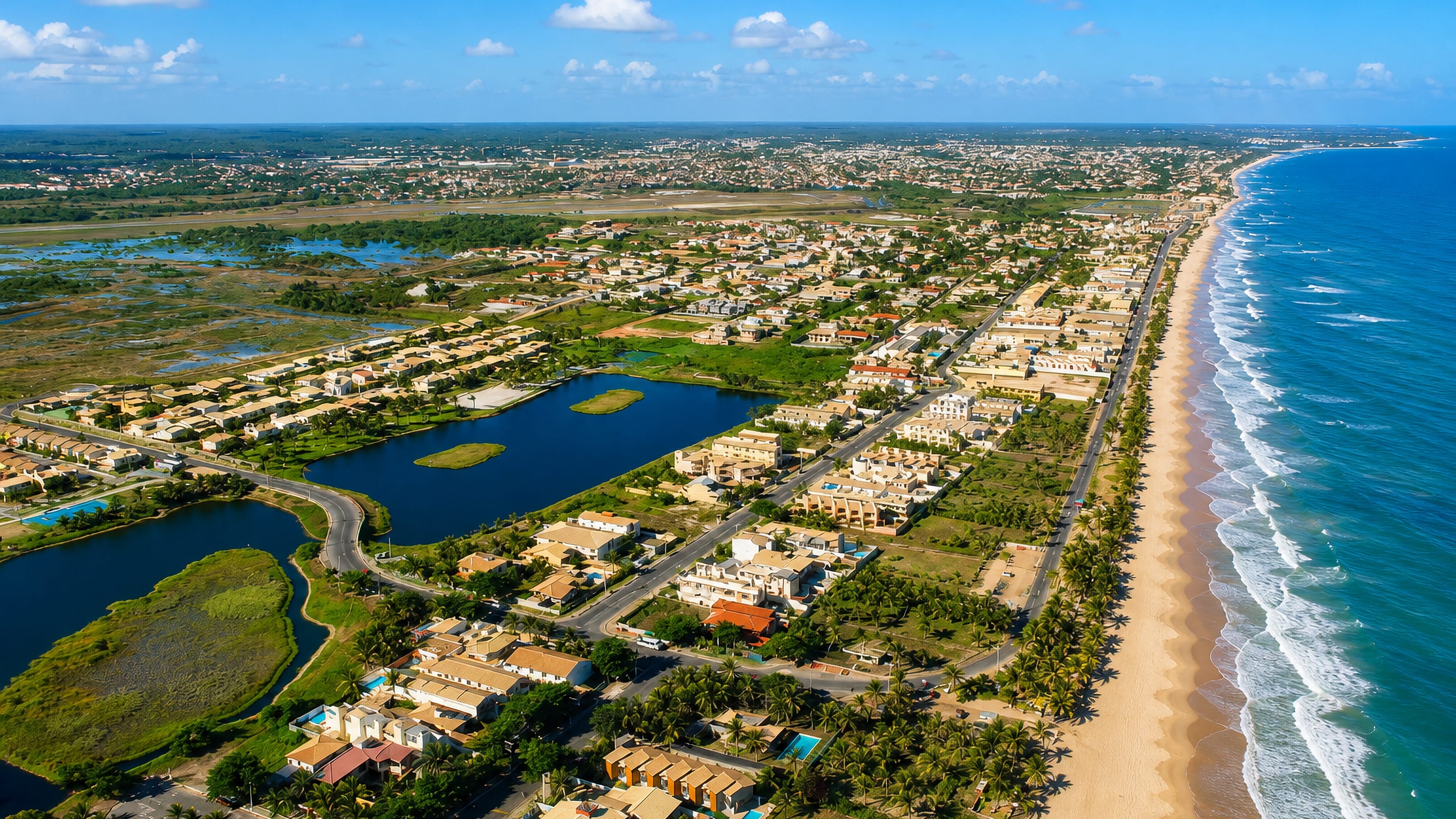 Aerial view of Stella Maris in Salvador, with its beach, surf, coastal lagoons and low-rise houses.