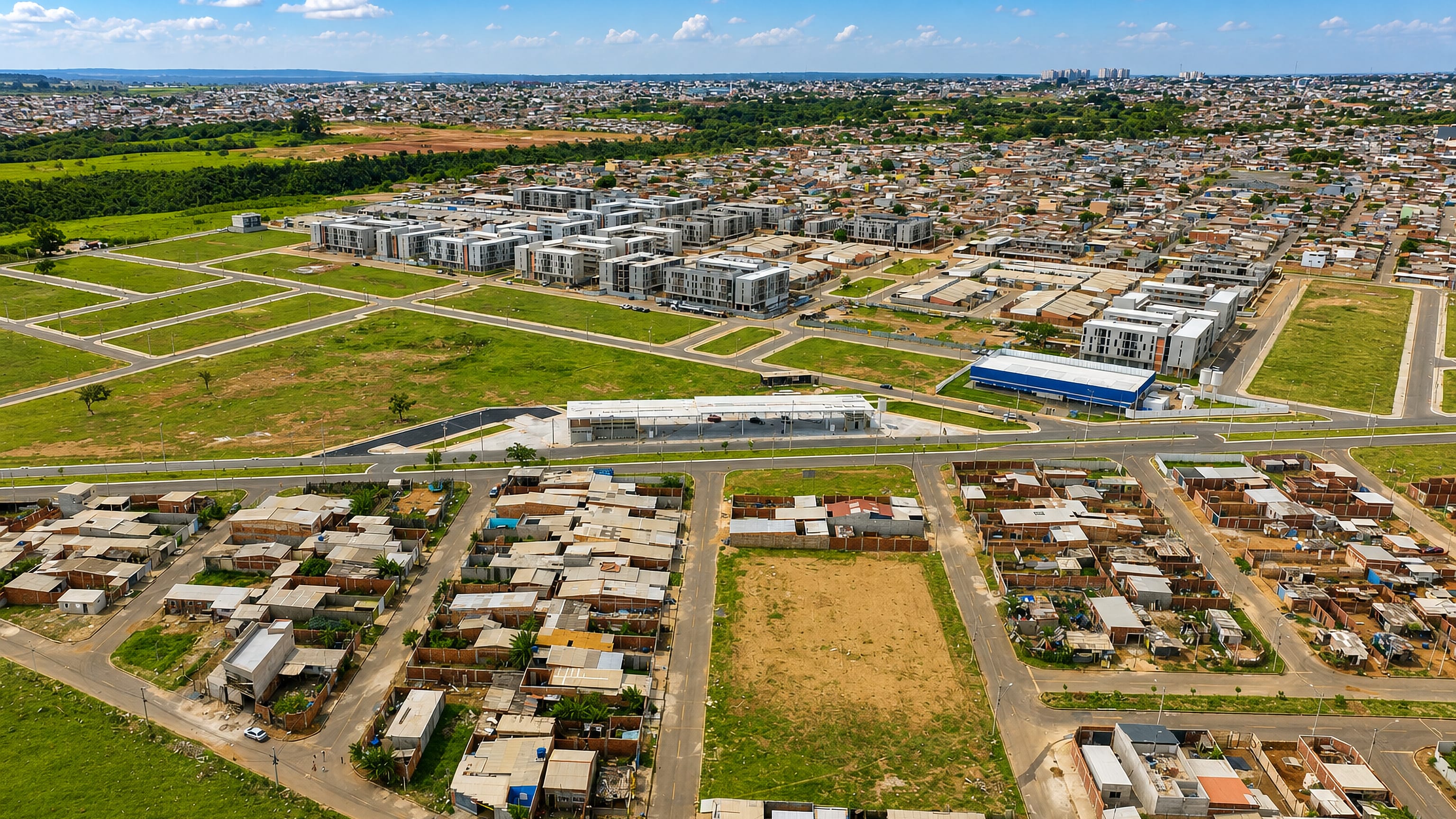 Aerial over the Pôr do Sol sector of Sol Nascente/Pôr do Sol, with self-built brick homes, new housing blocks and open lots.