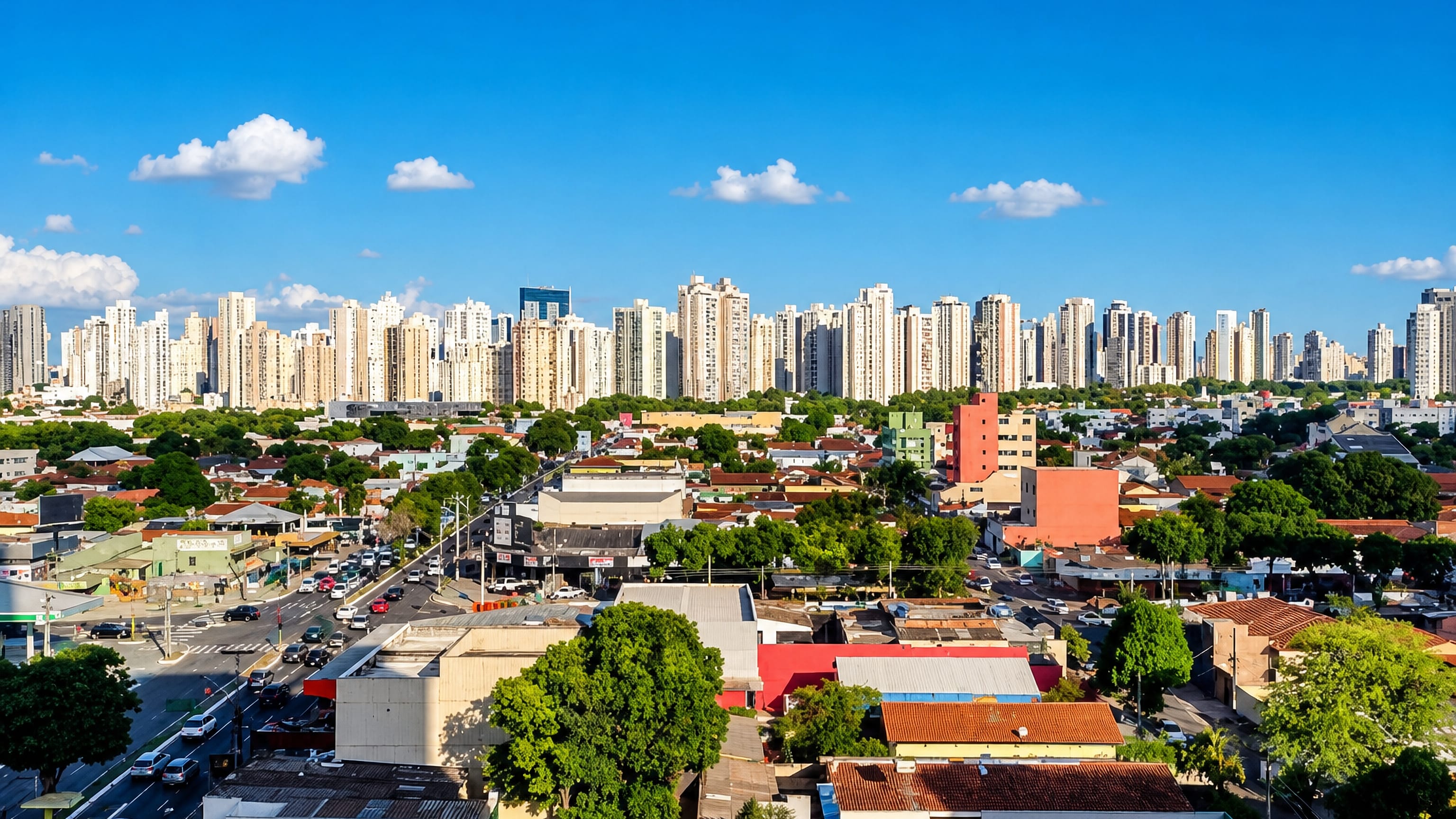 White apartment towers form Goiânia's skyline above leafy low-rise neighbourhoods in Goiás, Brazil.