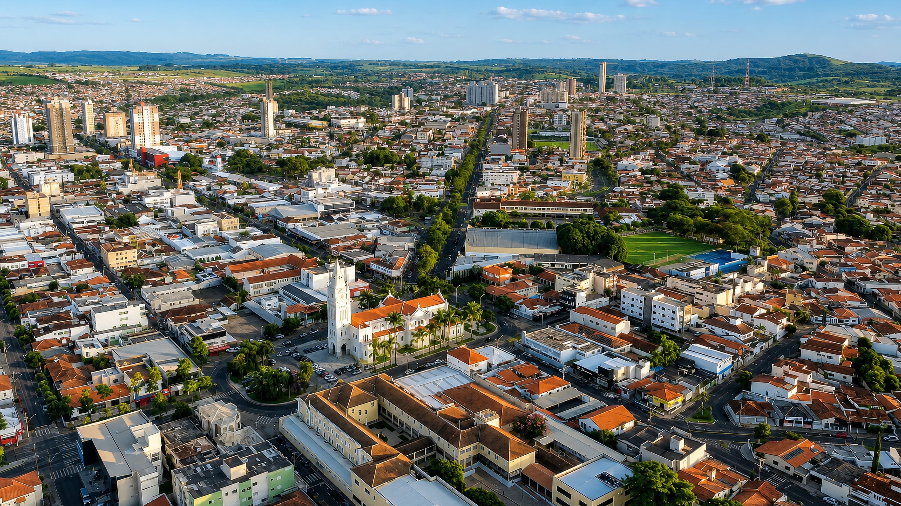 Aerial view of Araxá, Minas Gerais, Brazil, red-tiled rooftops around the white central church tower.