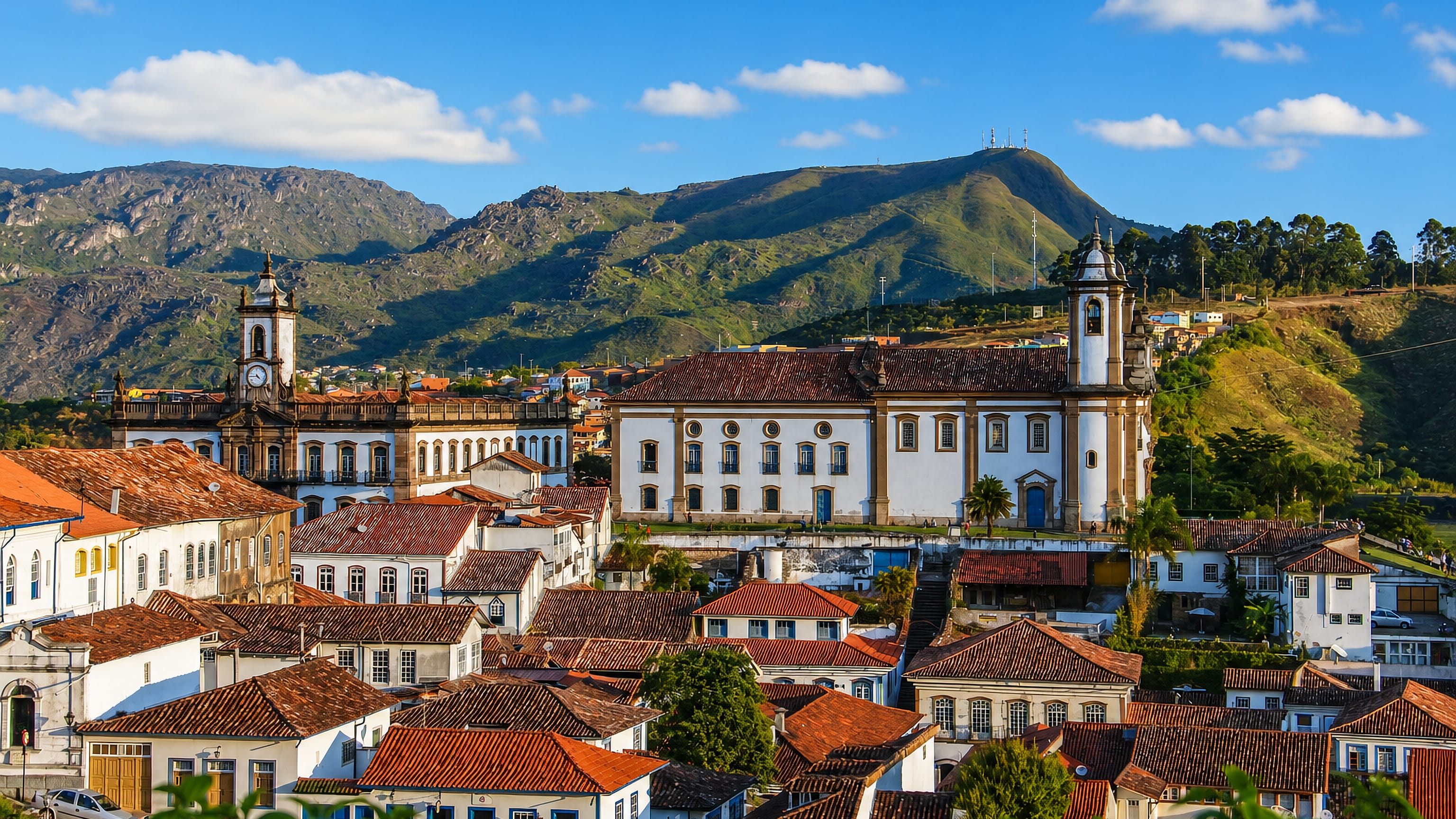 Ouro Preto's baroque churches and red-tiled colonial rooftops spread below the green hills of Minas Gerais.
