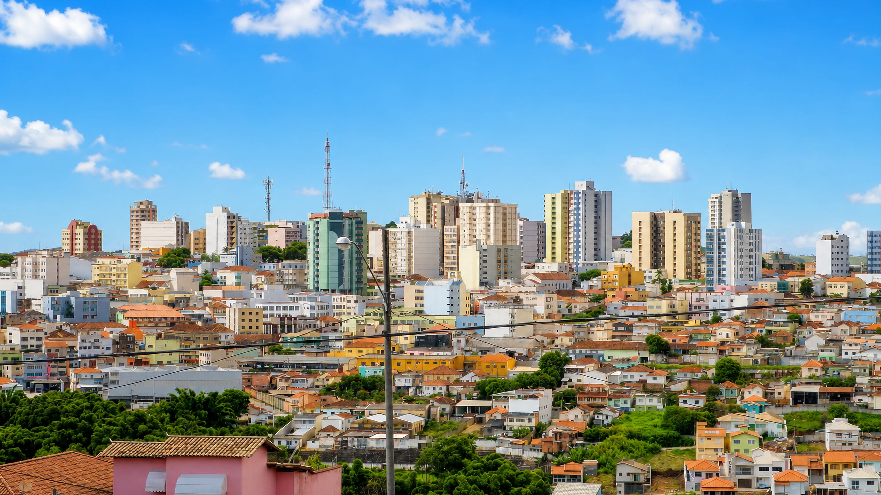 Varginha's hillside houses and apartment towers spreading over the hills of southern Minas Gerais.