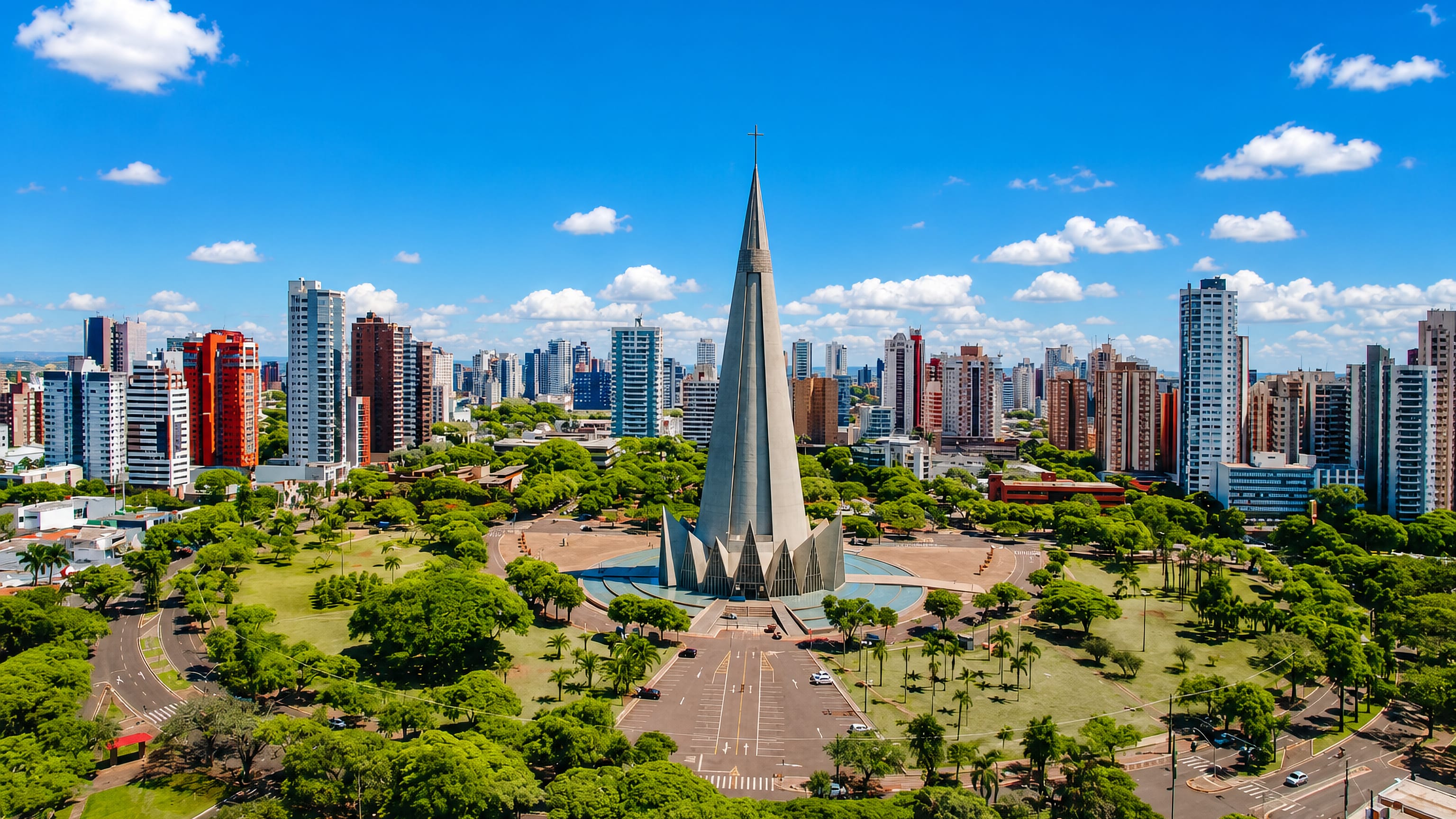 Maringá's cone-spired cathedral rising above the tree-filled central square and high-rise skyline in Brazil.