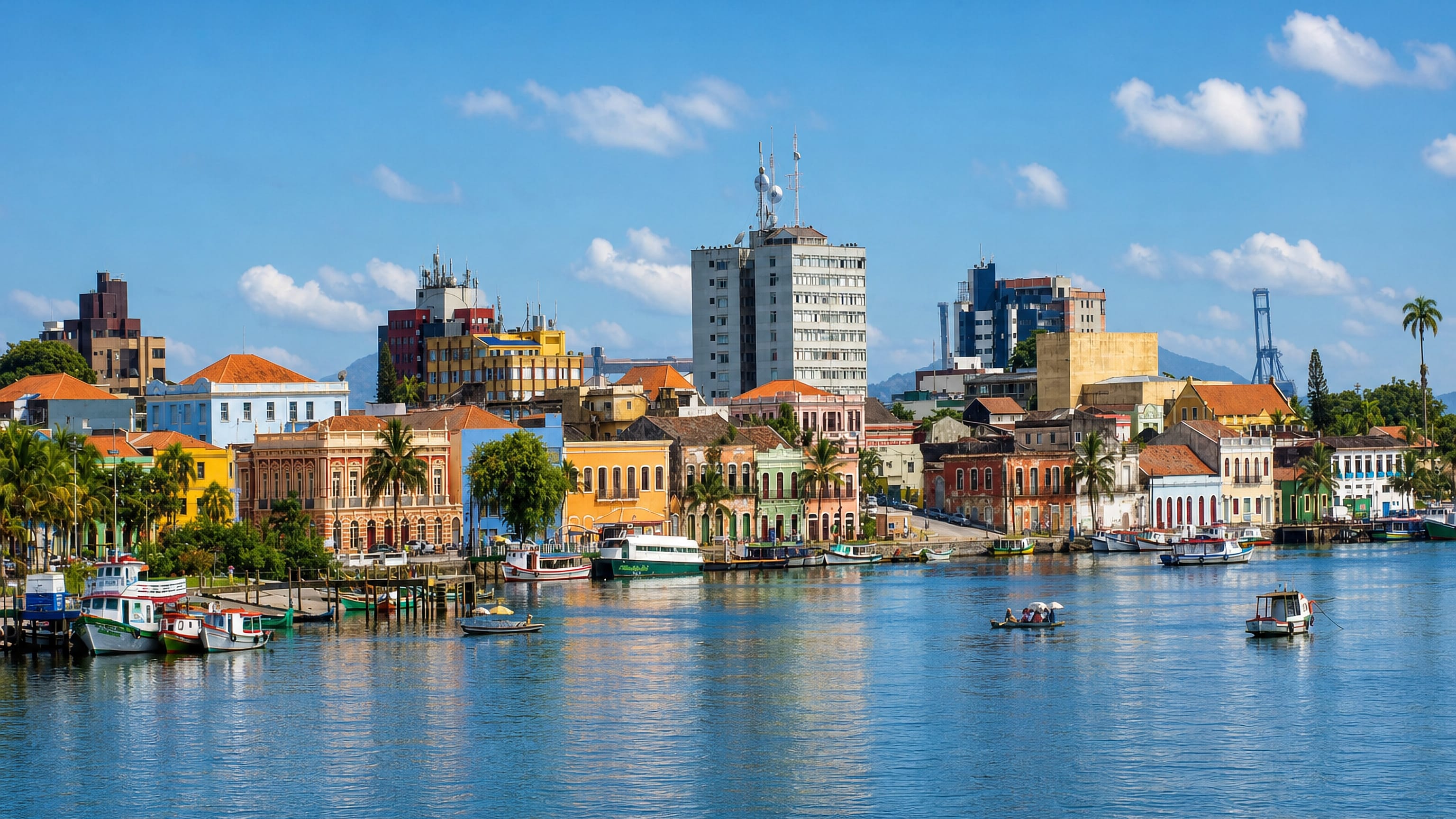 Colourful colonial waterfront of Paranaguá, Brazil, with fishing boats moored along the Itiberê River.