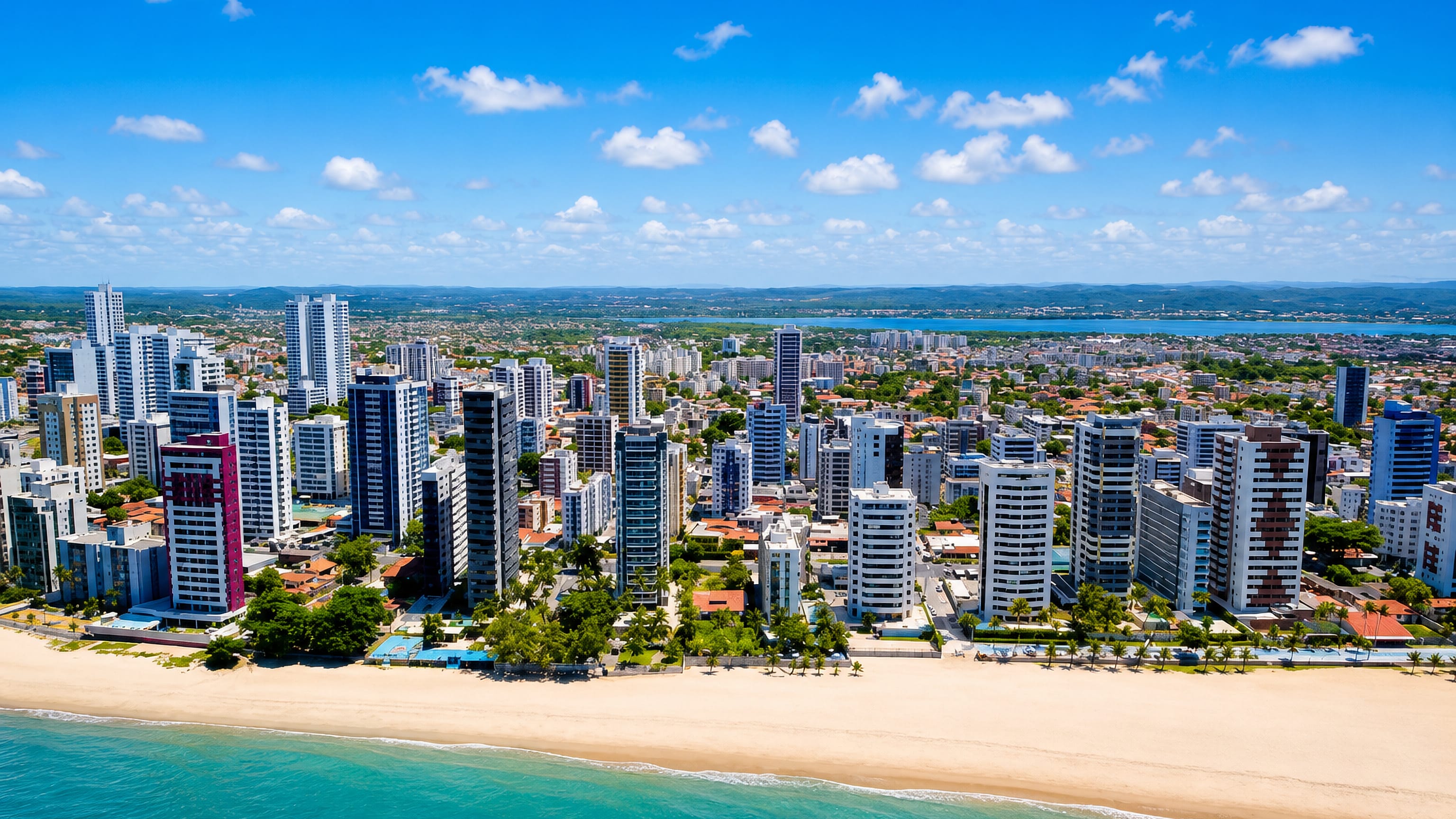 Aerial view of the Jaboatao dos Guararapes beachfront, high-rise towers lining a broad sandy beach.