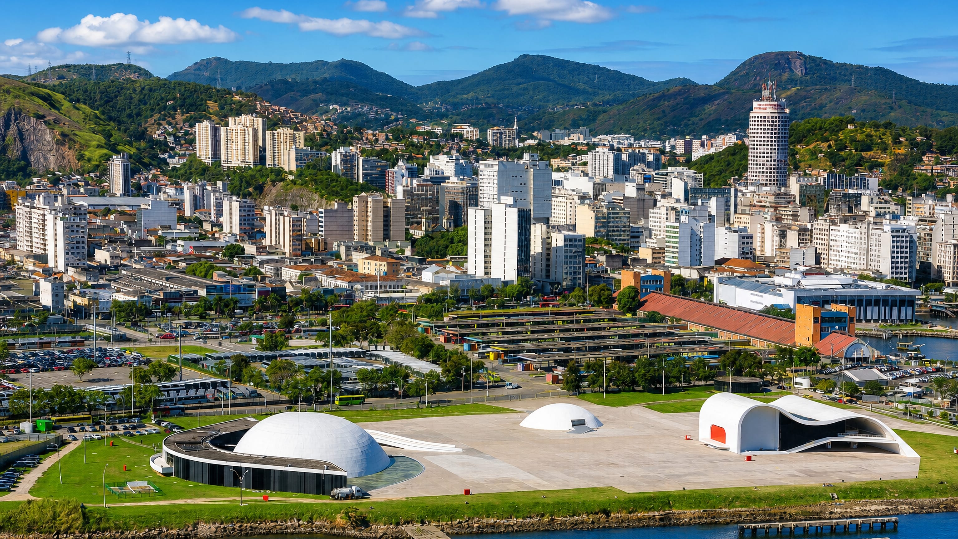Niteroi, Brazil, above Guanabara Bay, with Niemeyer's white domed cultural buildings below the downtown skyline.