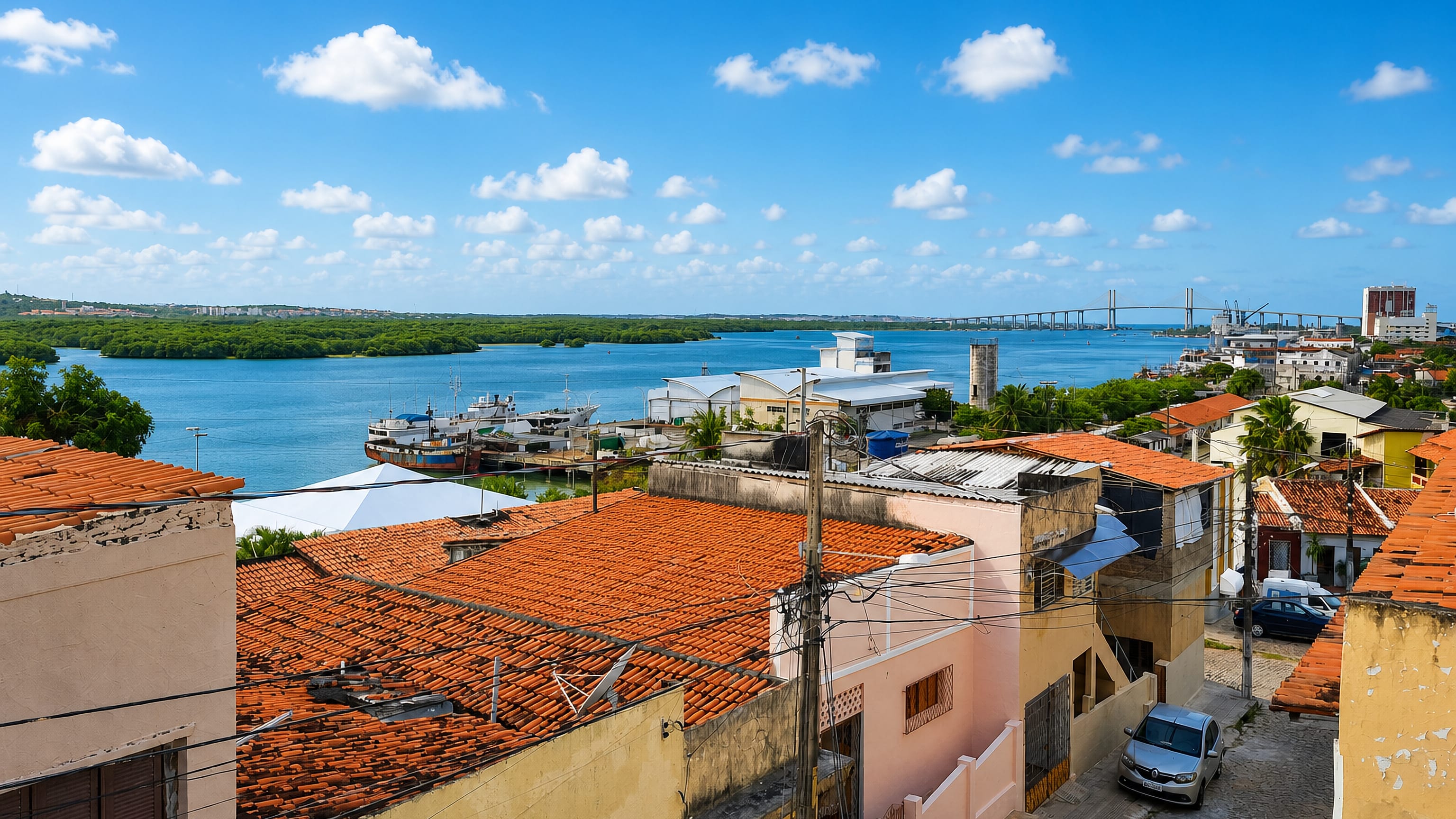 Tiled rooftops of Cidade Alta above the Potengi river with the Newton Navarro bridge, Natal.