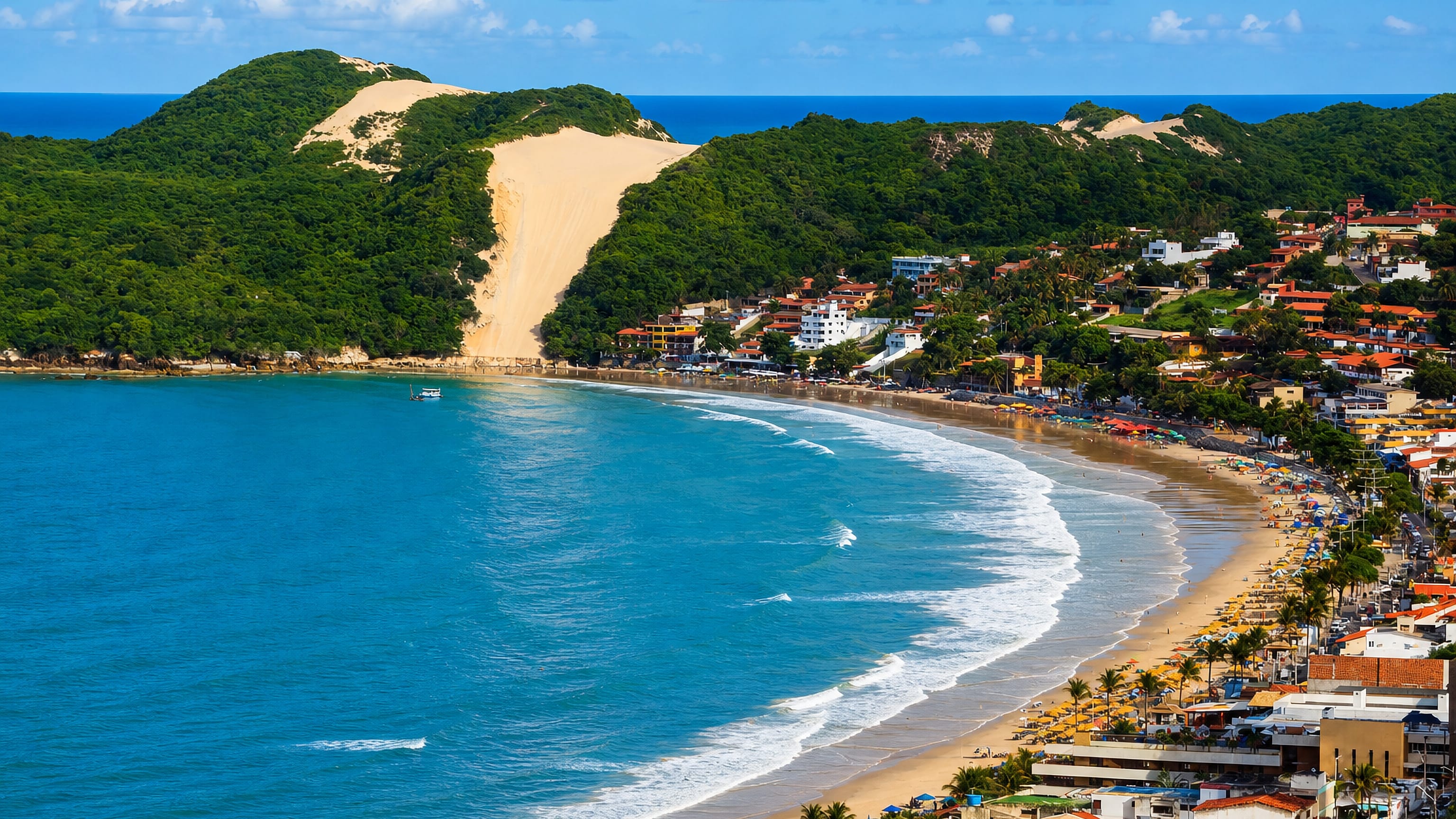 Ponta Negra beach curving below the Morro do Careca dune, with Natal's beachfront hotels lining the shore.