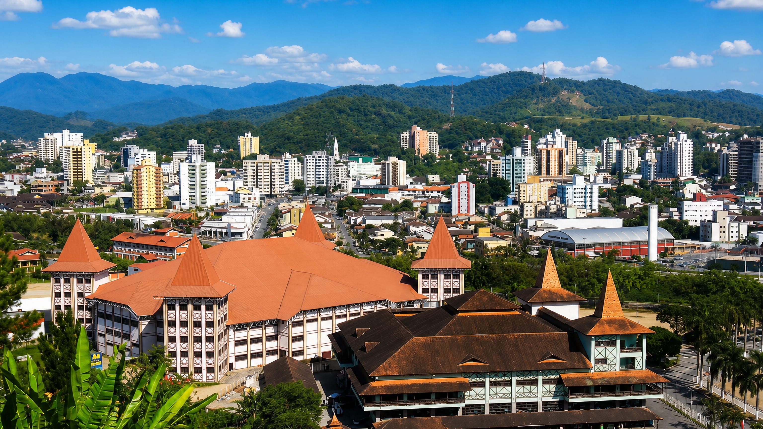 Aerial view of Brusque, Santa Catarina, with its half-timbered Germanic exhibition pavilions below forested hills