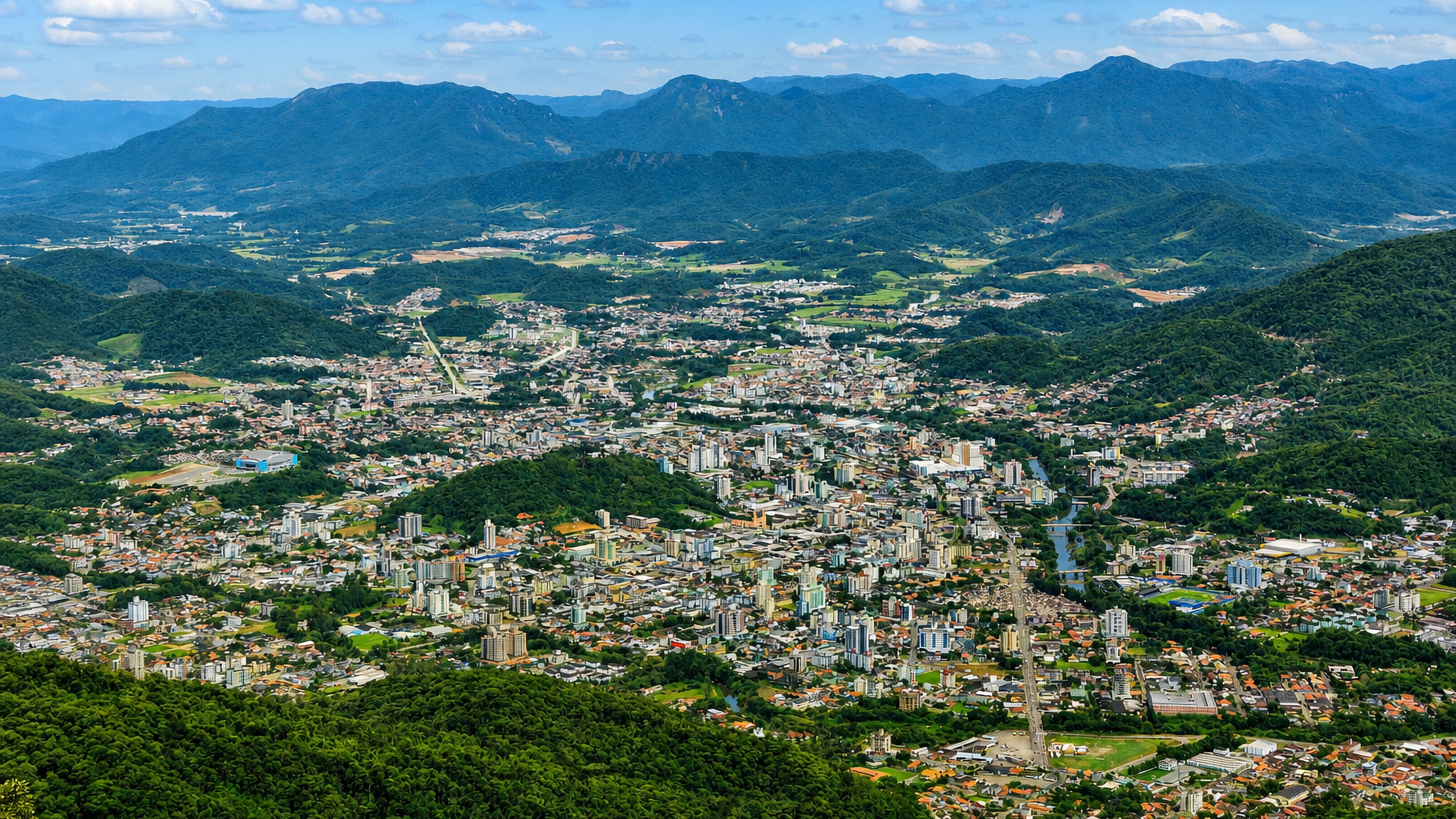 Jaragua do Sul, Brazil spread across its valley floor and ringed by the forested Serra do Mar.
