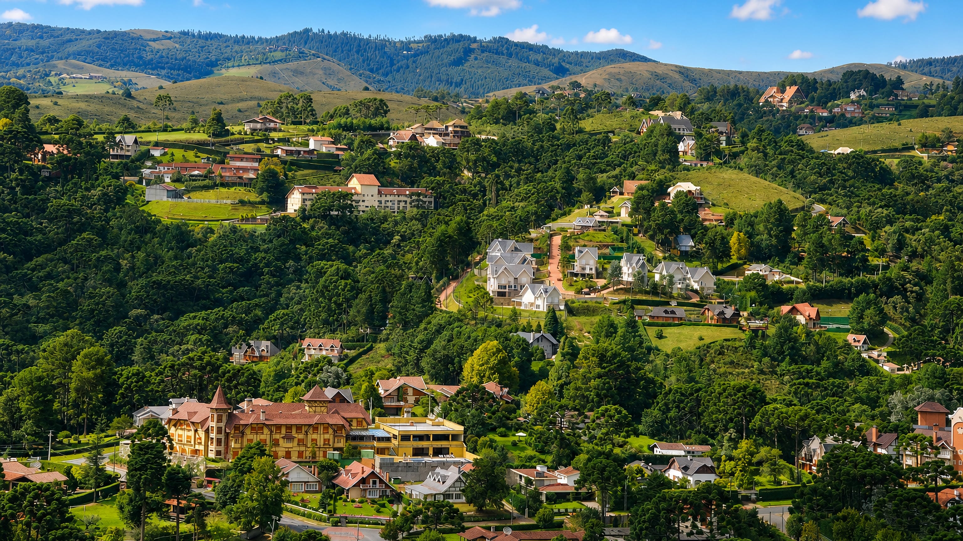 Alpine-style chalets and hotels scattered across the forested Mantiqueira hills at Campos do Jordao, Brazil.