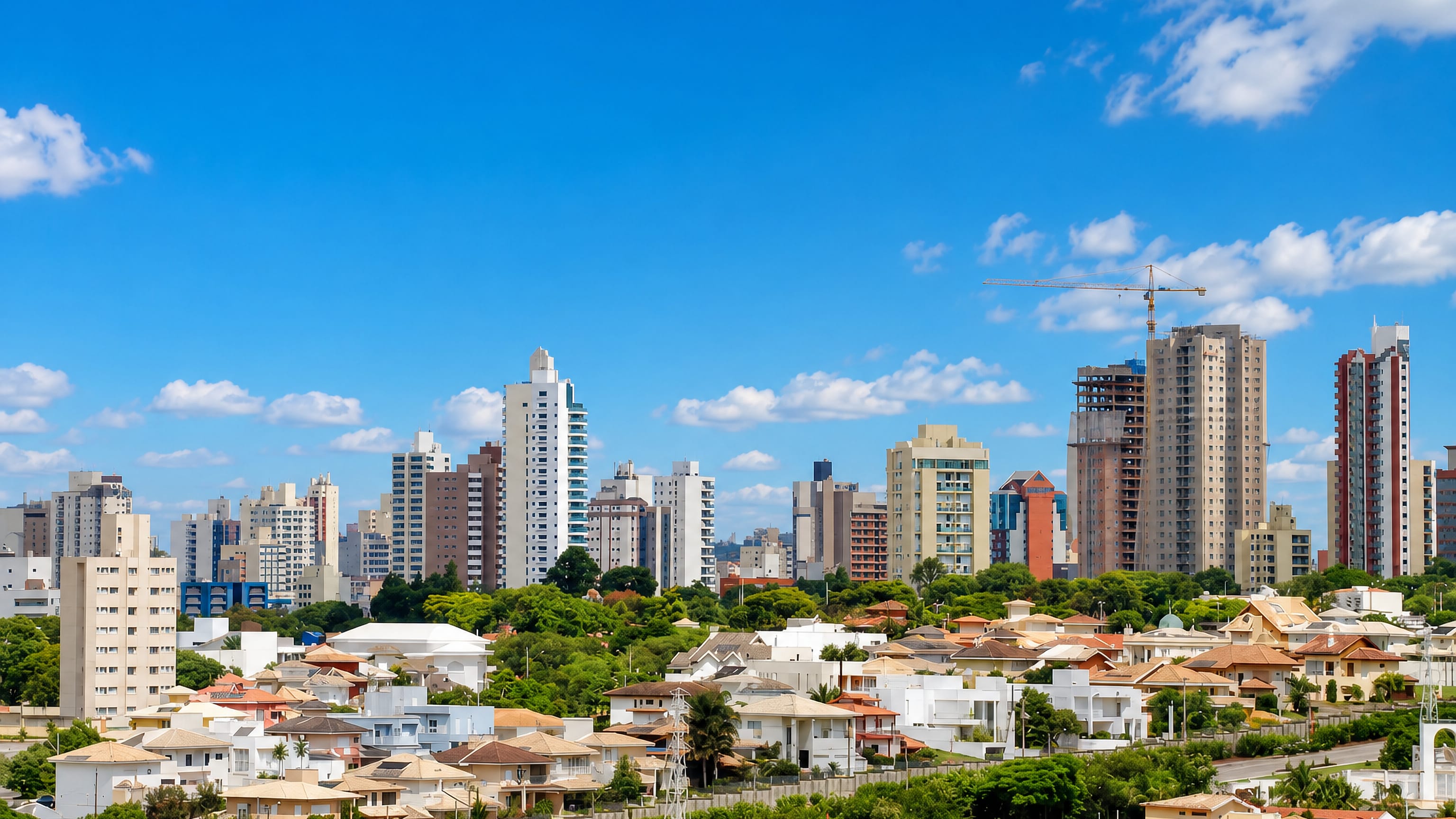 Jundiaí, Brazil, with apartment towers rising above leafy hillside neighbourhoods of low houses.