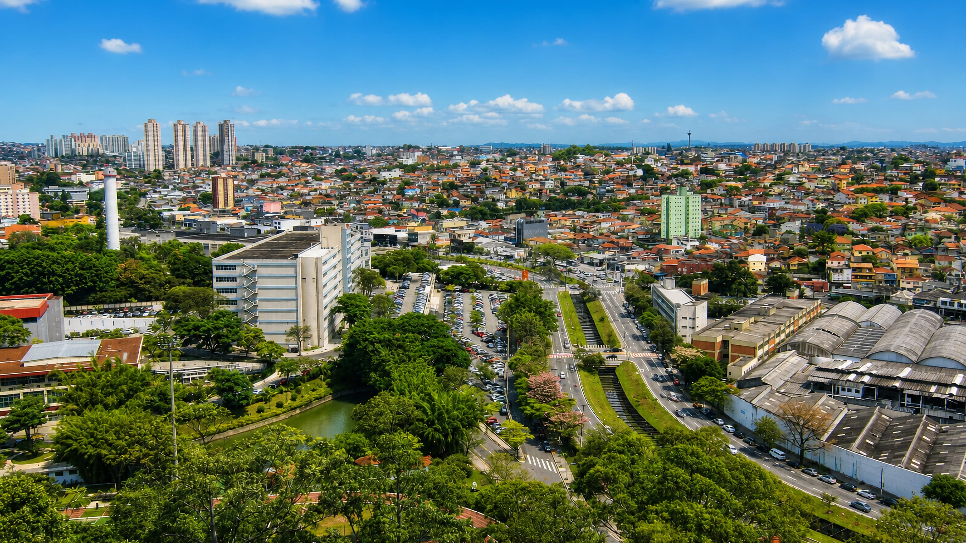 Aerial view over Osasco, Brazil, red-tiled houses and apartment towers spreading across the São Paulo metro area.