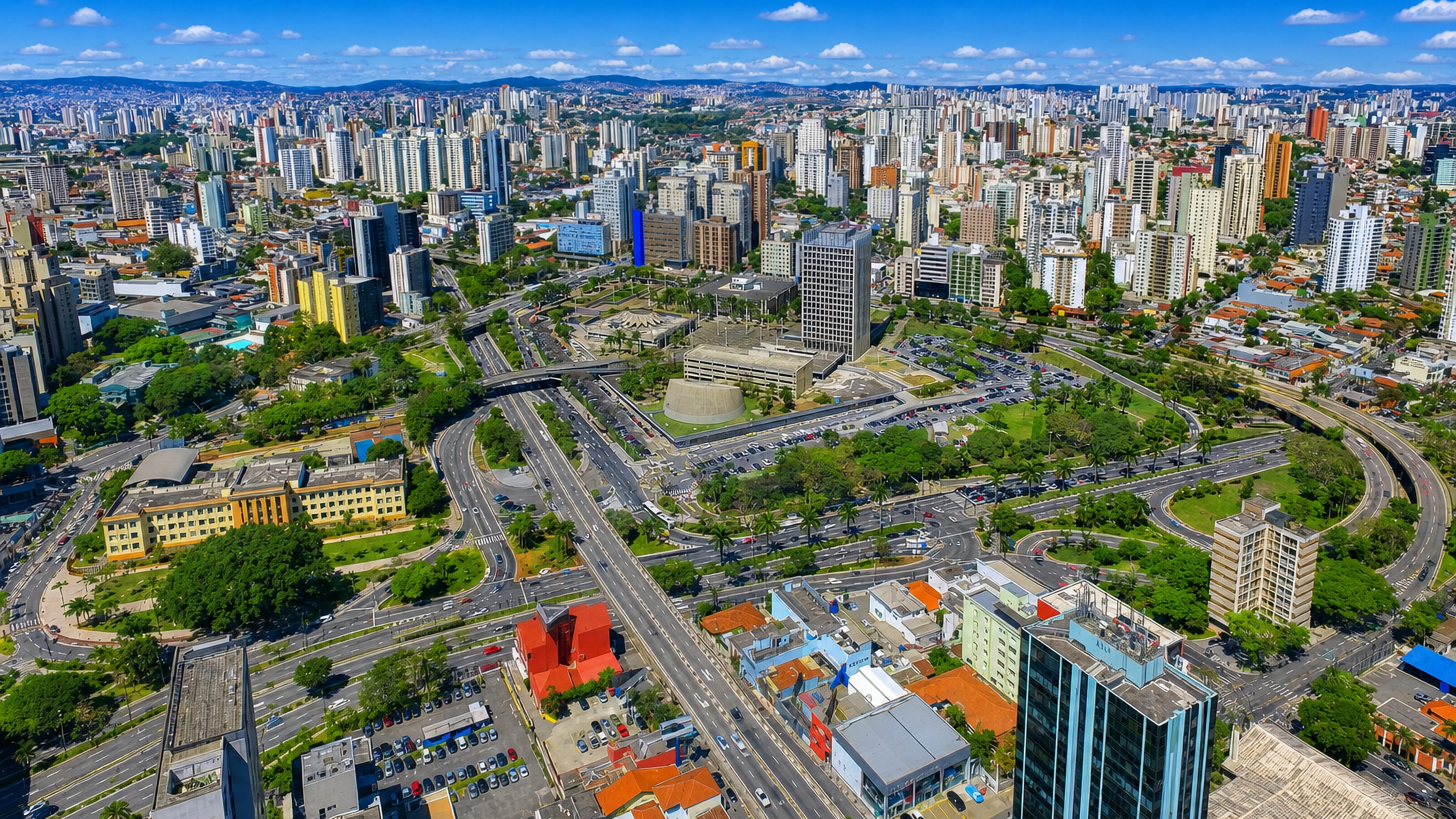 Aerial view of Santo André, Brazil, with wide avenues, a highway interchange and dense high-rises.