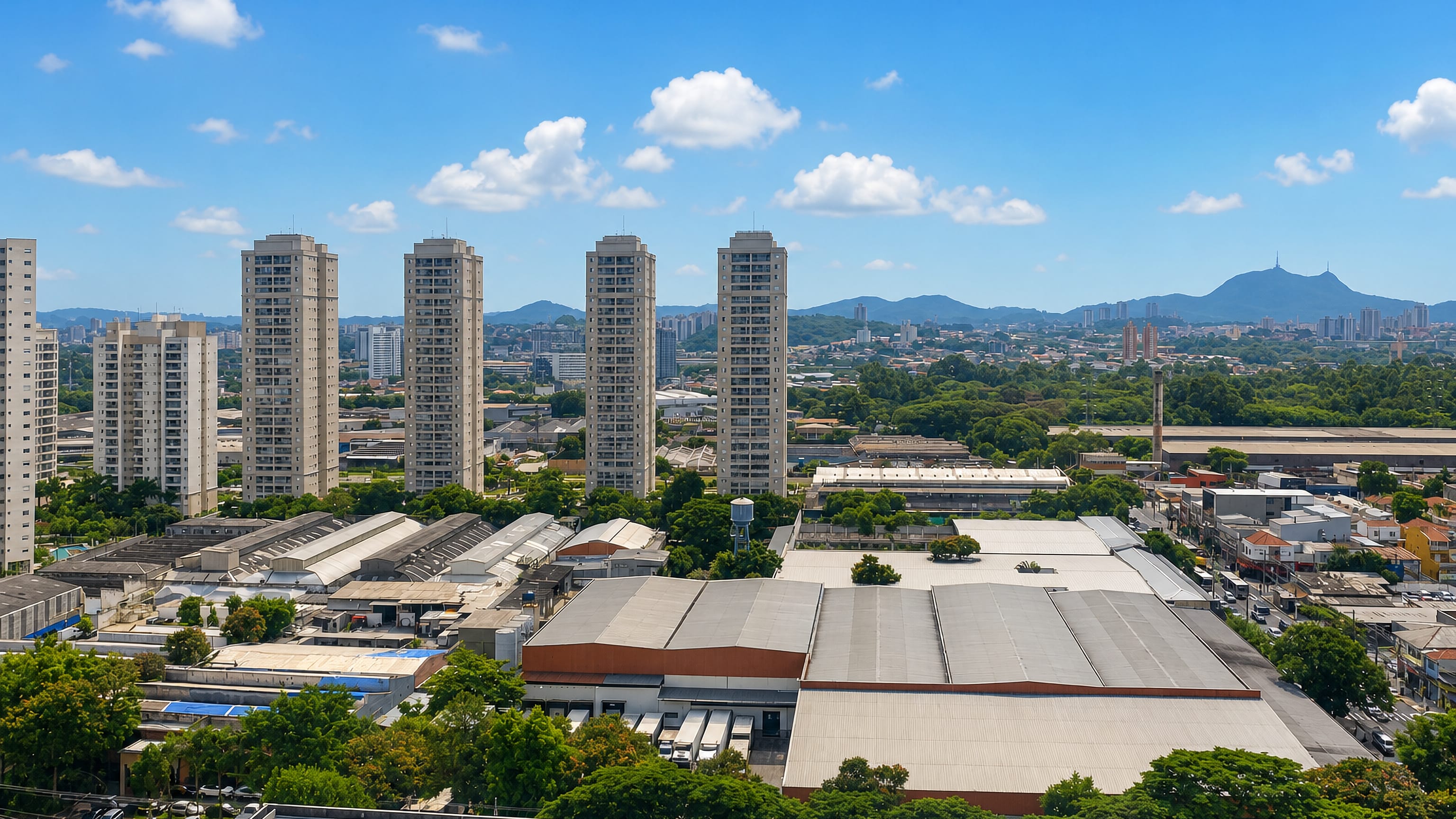 Warehouses and residential towers of Vila Leopoldina, São Paulo, with Pico do Jaraguá on the far horizon.