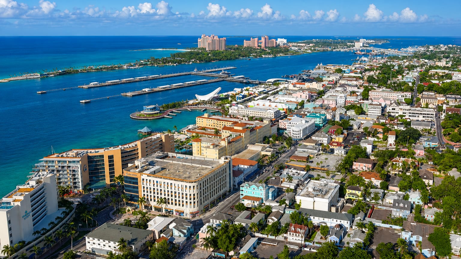 Aerial view of Nassau's harbour, colourful downtown and cruise piers with Paradise Island beyond.