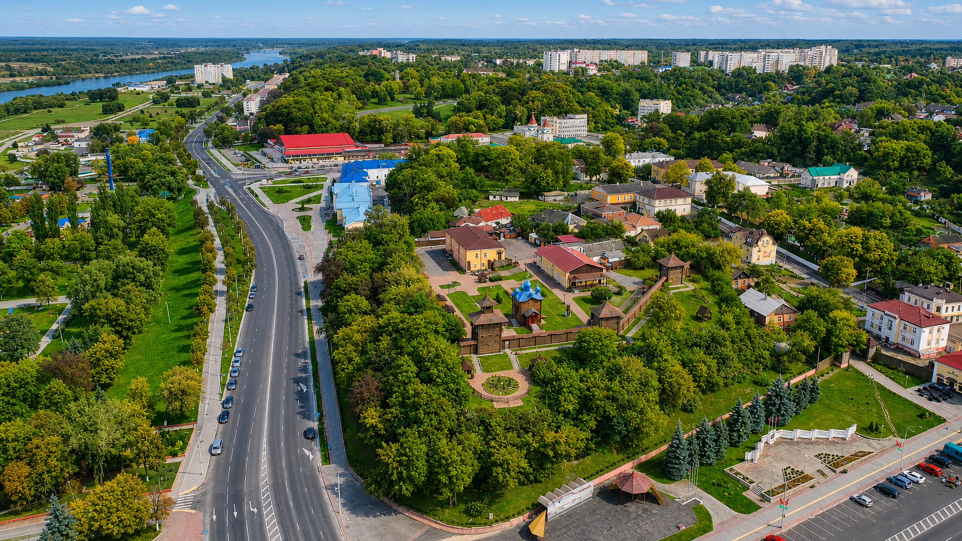 Aerial view of Mazyr, Belarus, with its wooden castle, tree-lined boulevard and the Prypiats River beyond.
