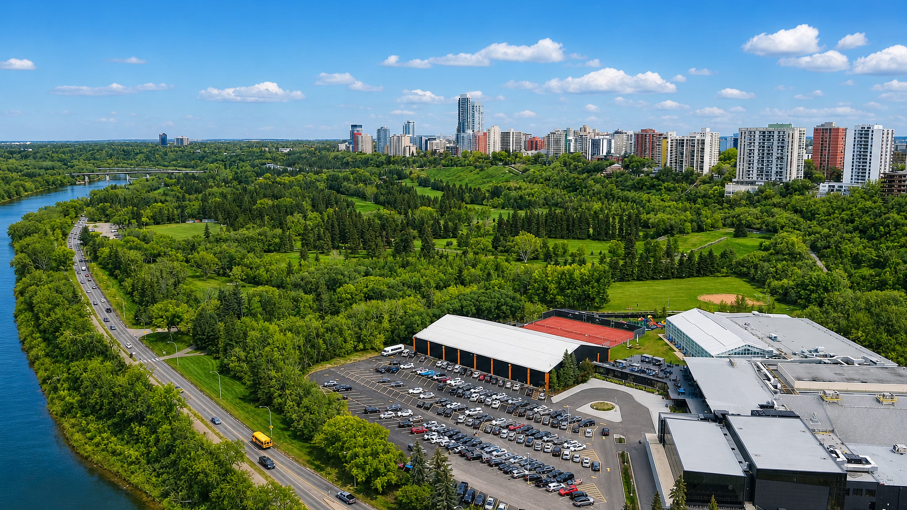 Highrise apartment towers above the North Saskatchewan River valley parkland at Wîhkwêntôwin, Edmonton.