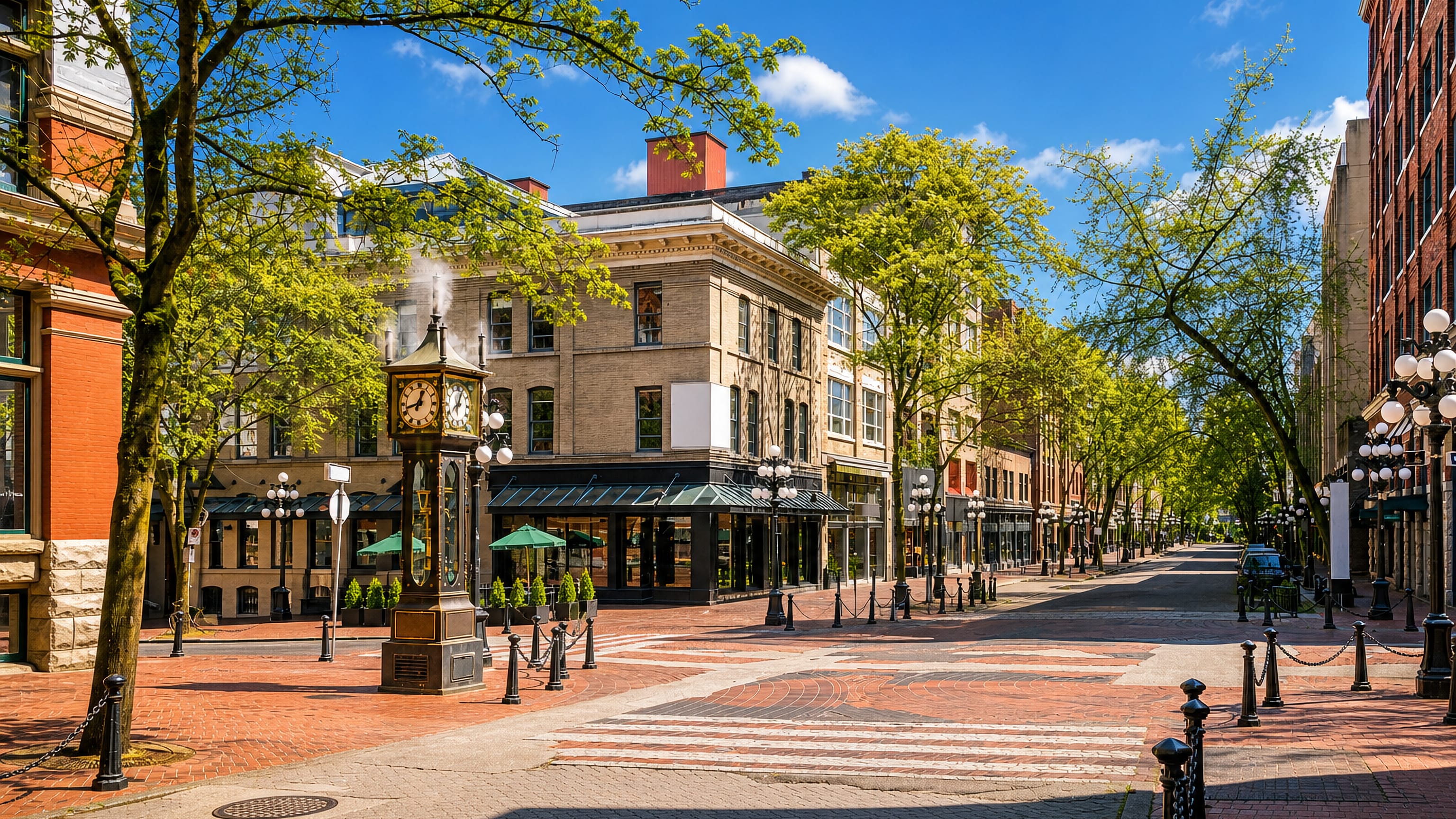 The steam clock on brick-paved Water Street among Victorian buildings in Gastown, Vancouver